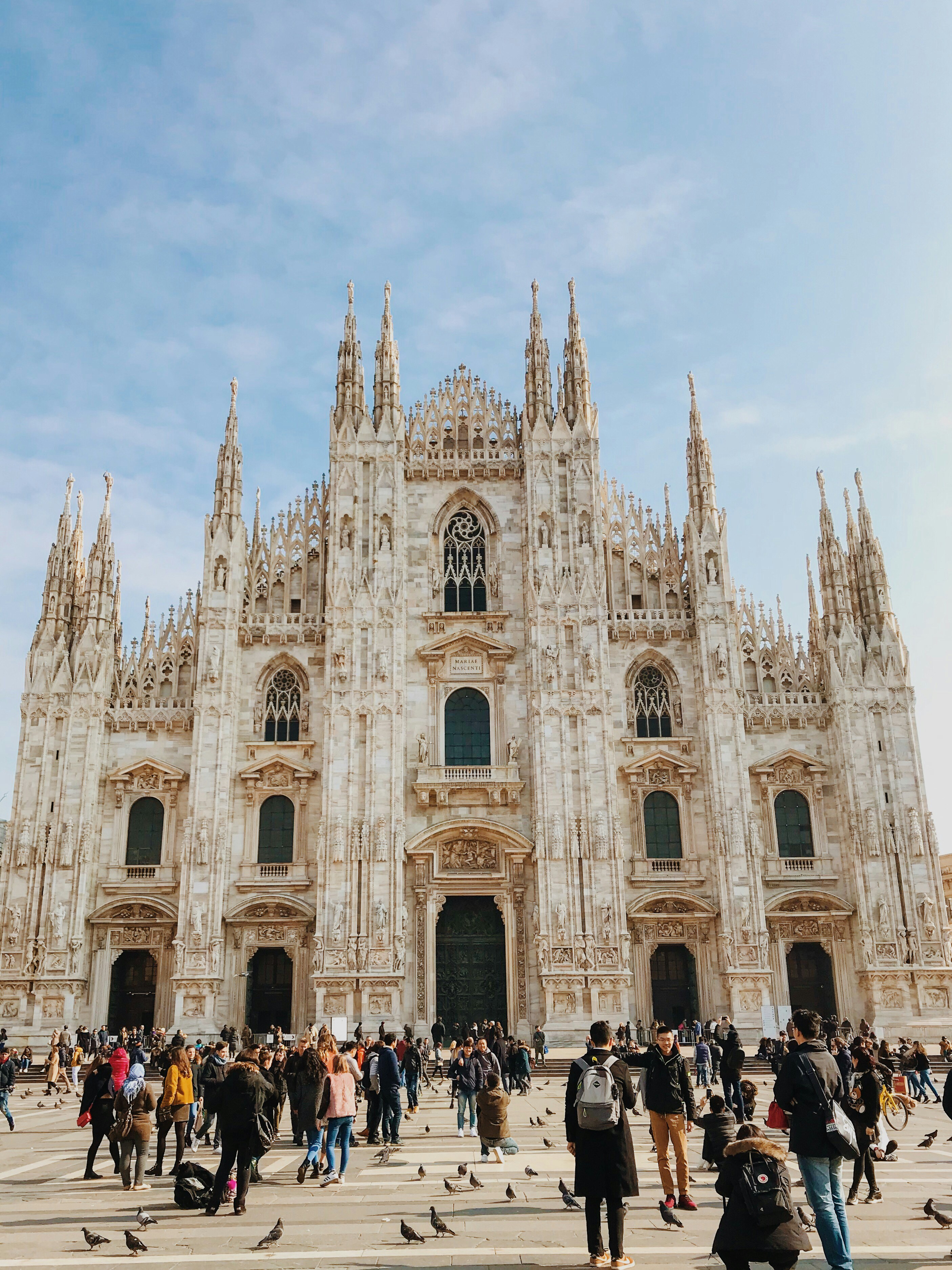 Photo by Unsplash An illustrative photo of a crowd of people in front of the Milan Cathedral