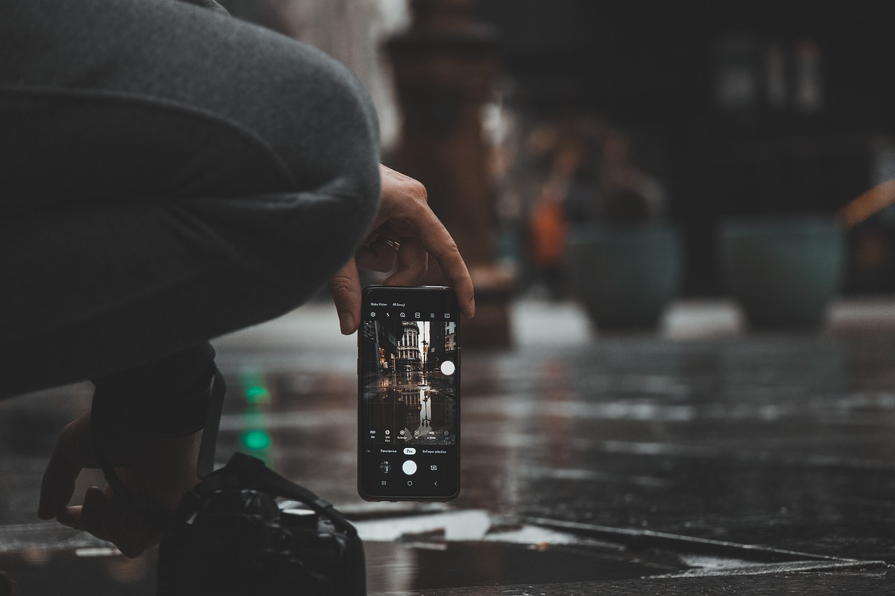 Photo by Pixabay An illustrative photo of a person holding a smartphone with the camera app open.