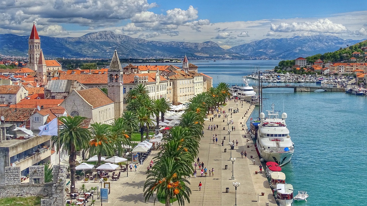 An illustrative photo of a coastal town with historical architecture.