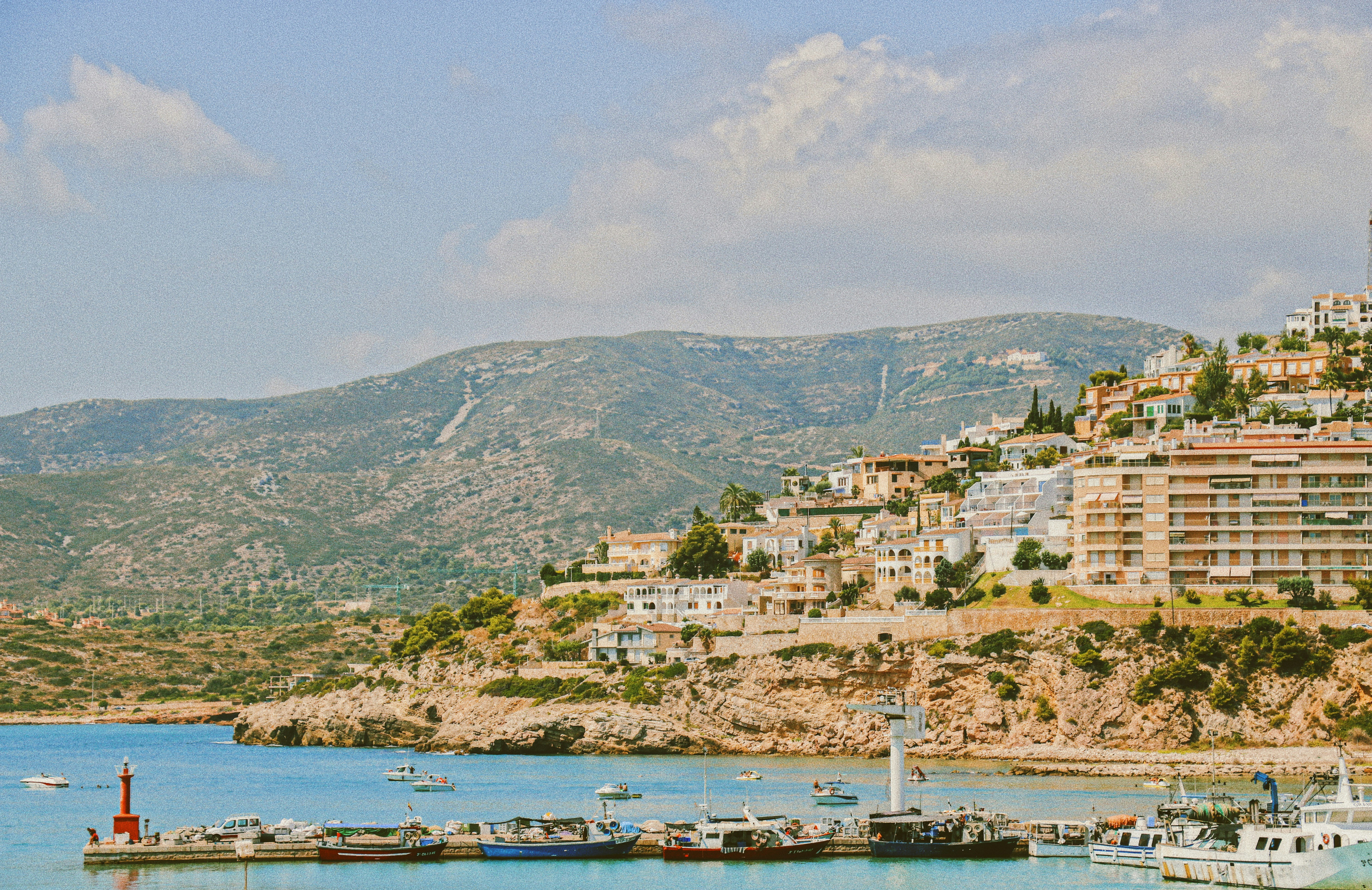 Photo by Unsplash An illustrative photo of buildings near body of water.