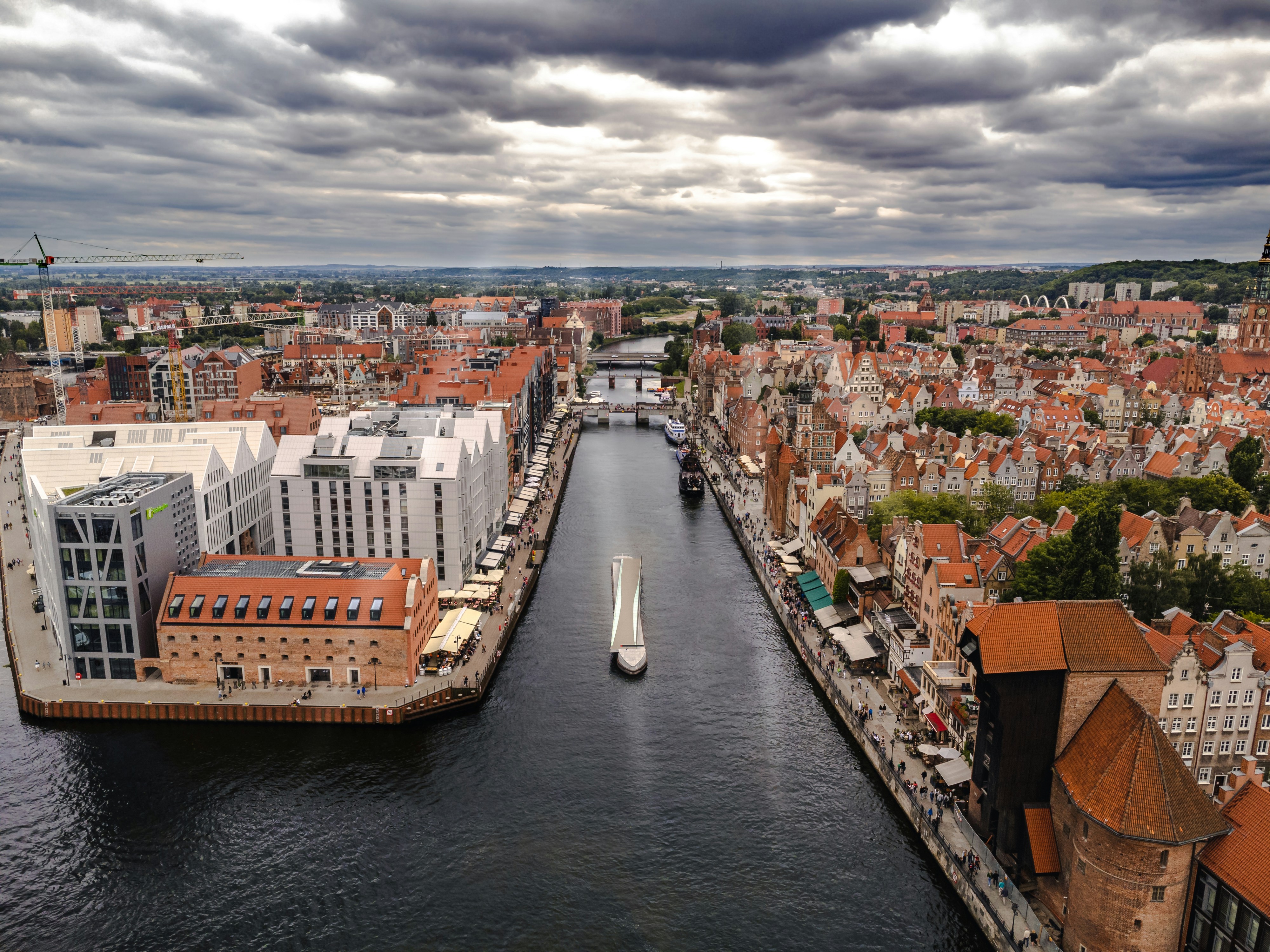 An illustrative photo of a city with a river running through it.