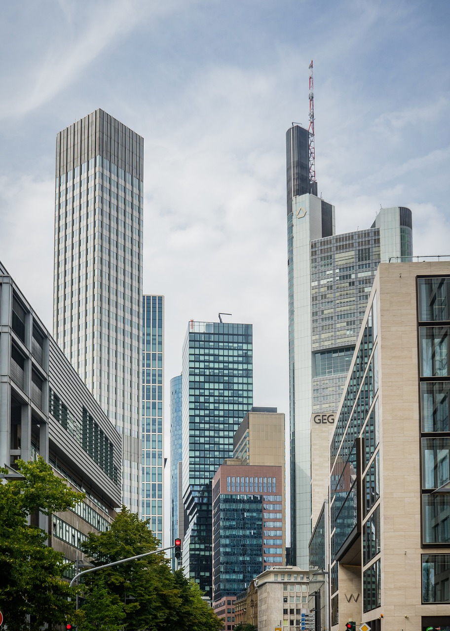 An illustrative photo of green trees near skyscrapers in Germany