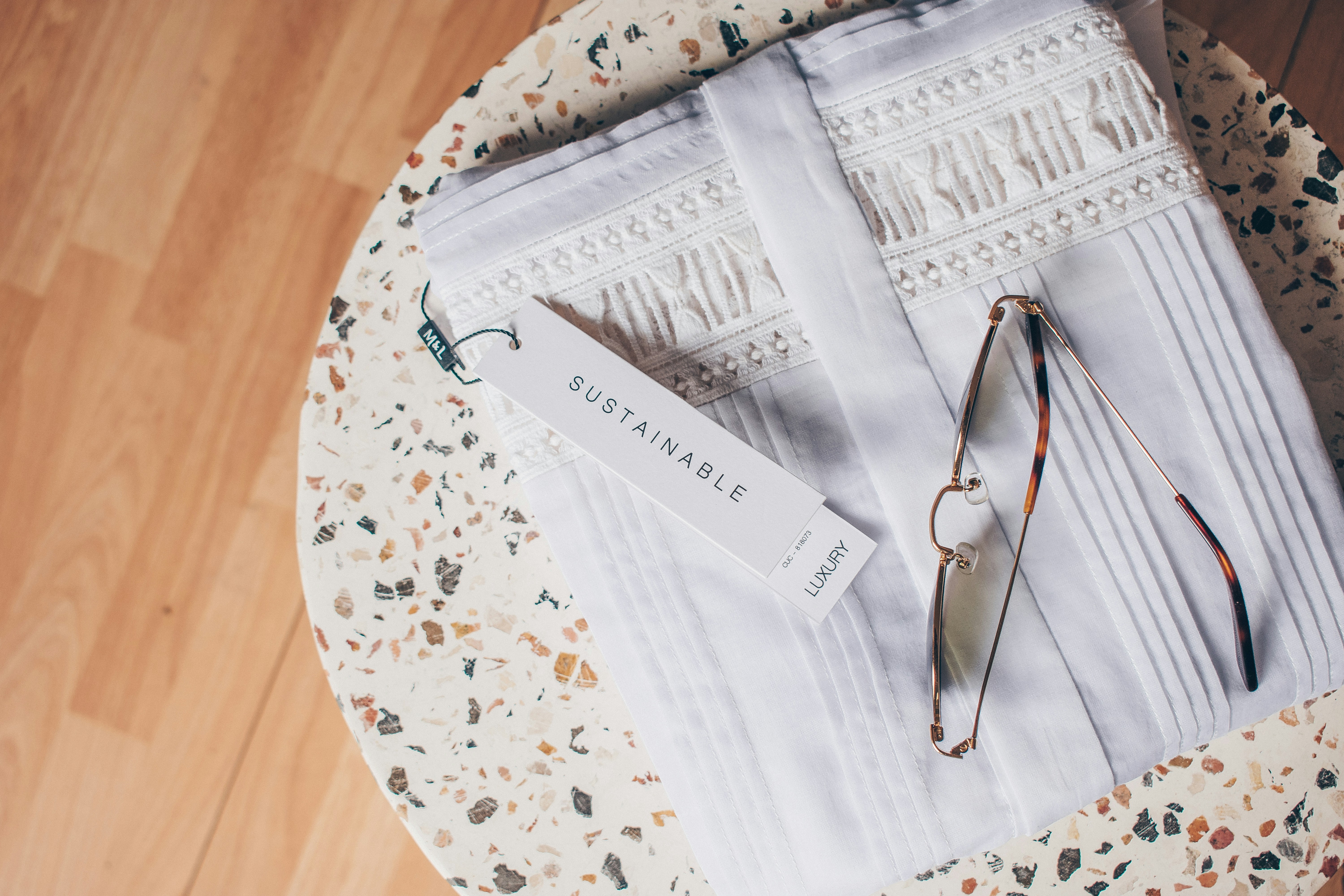 An illustrative photo of a table with papers and glasses on it