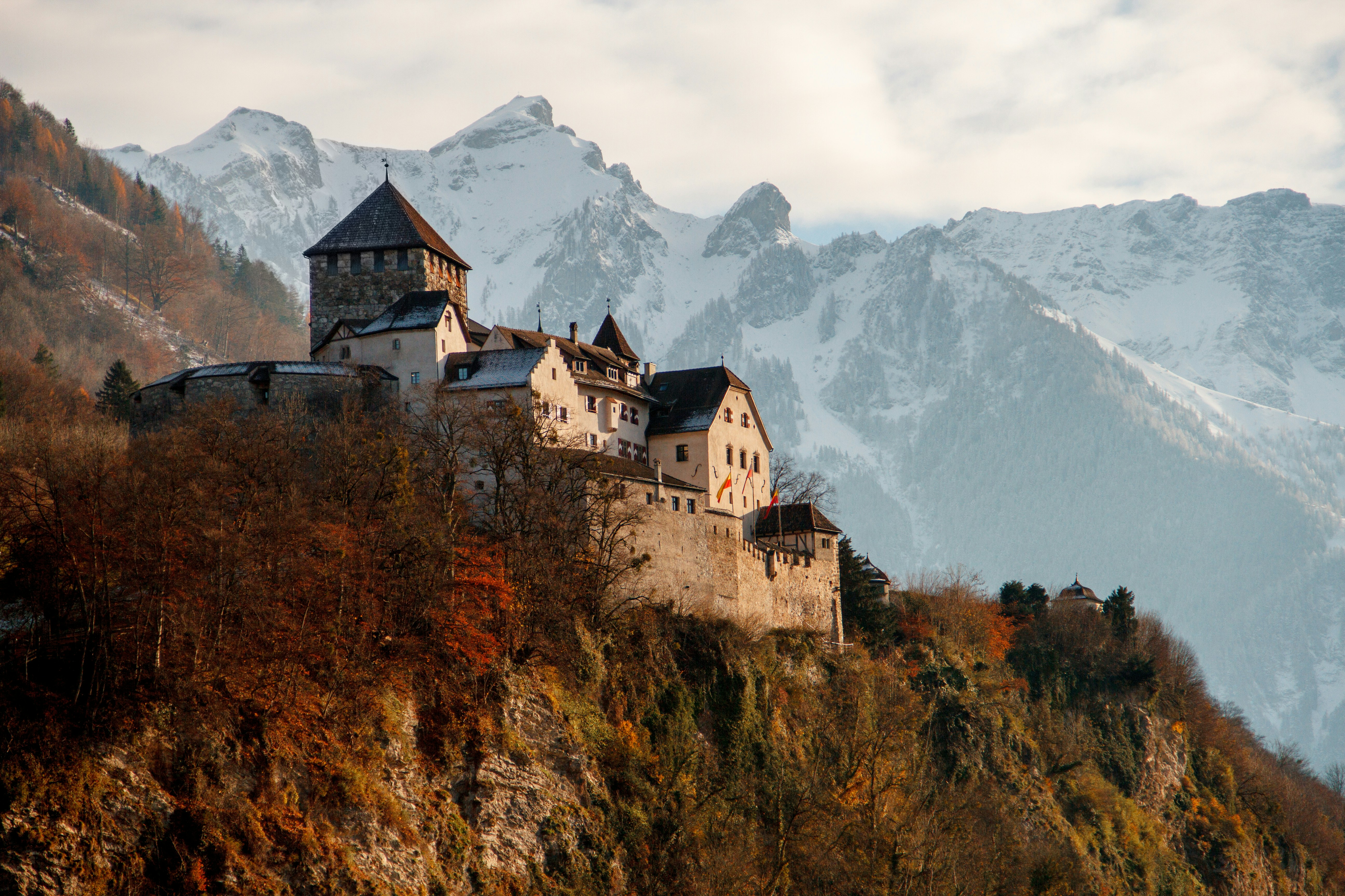 An illustrative photo of a castle on a mountain.