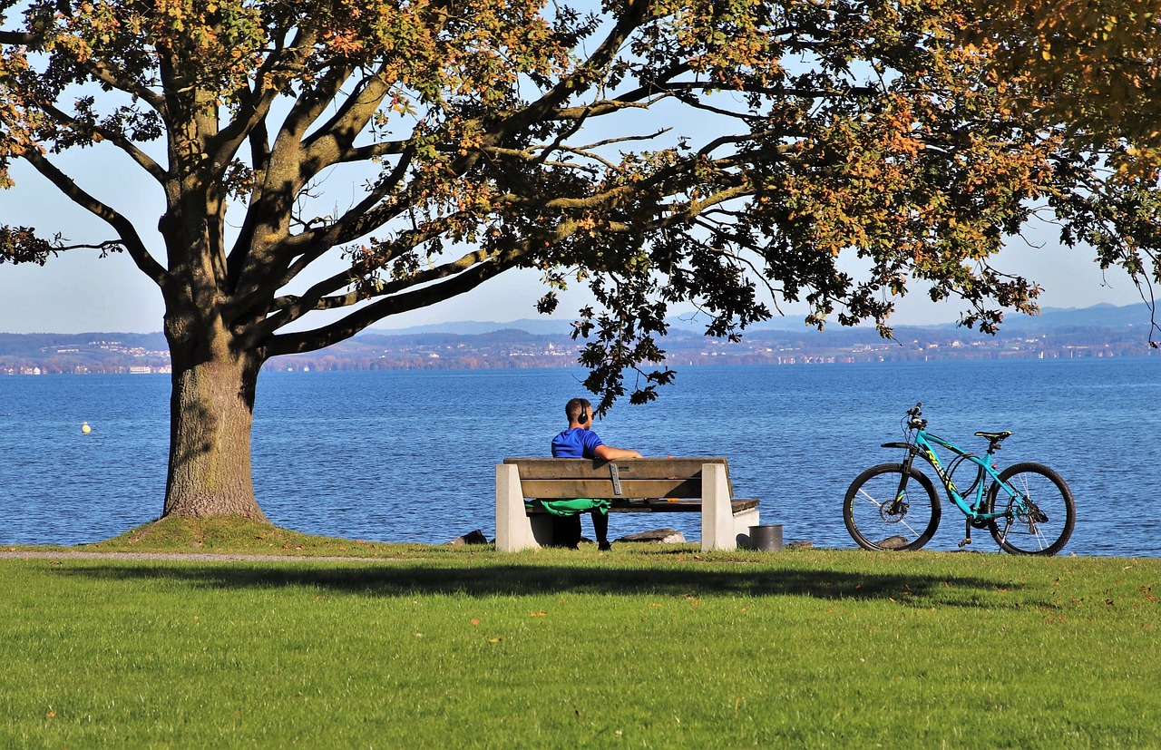 An illustrative photo of a person seated on a bench.