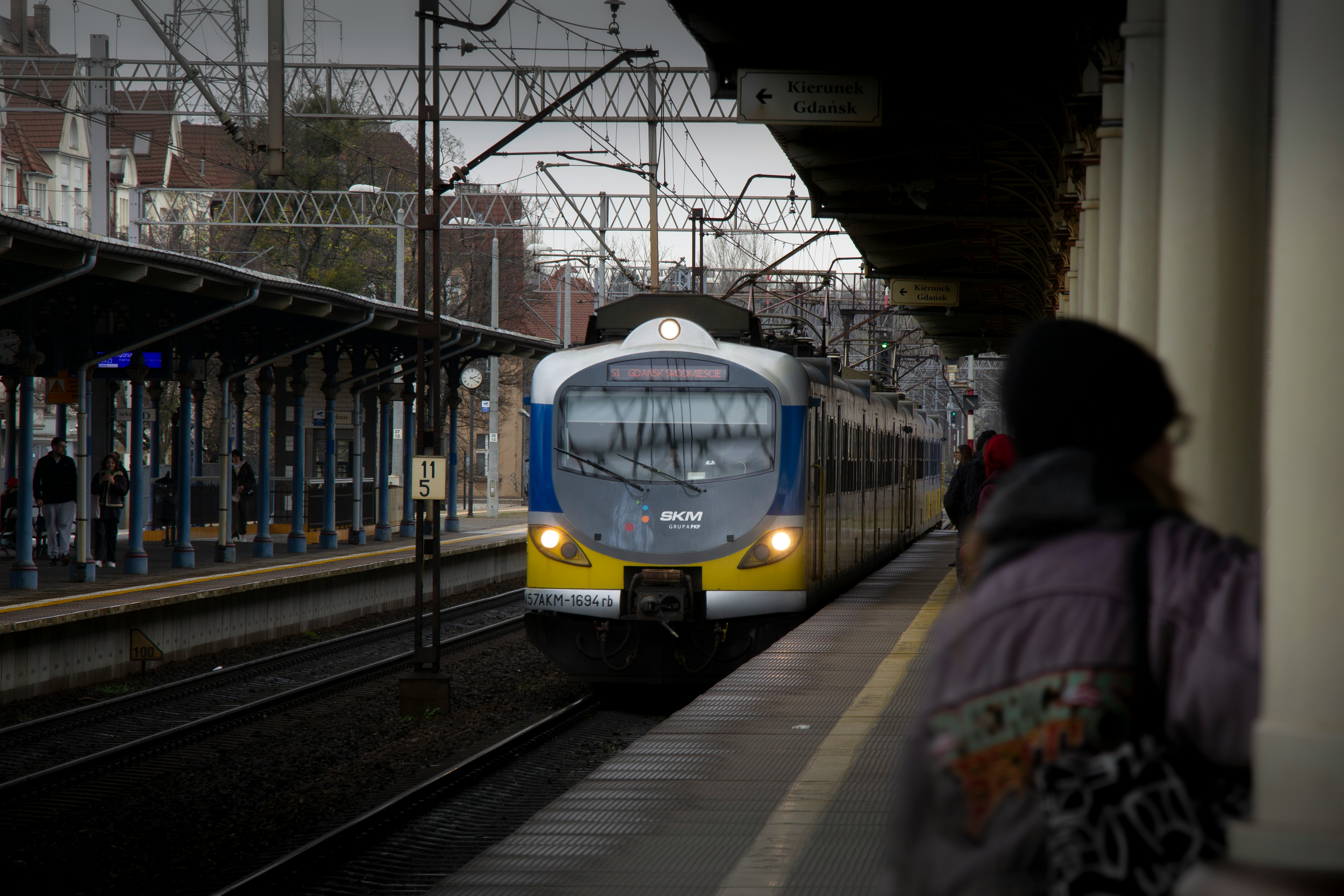 An illustrative photo of a passenger train pulling into a train station.