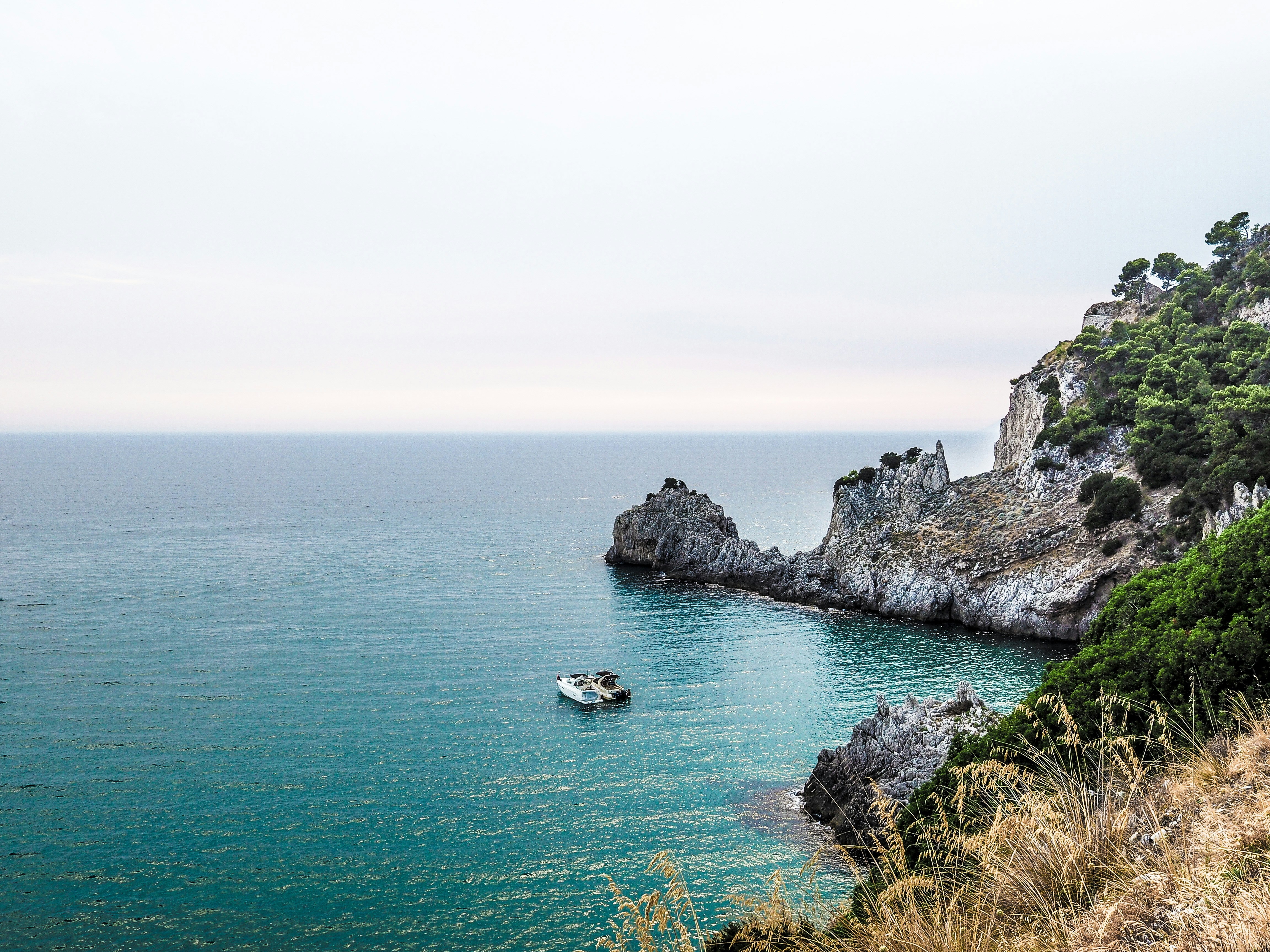 An illustrative photo of two boats near stone island