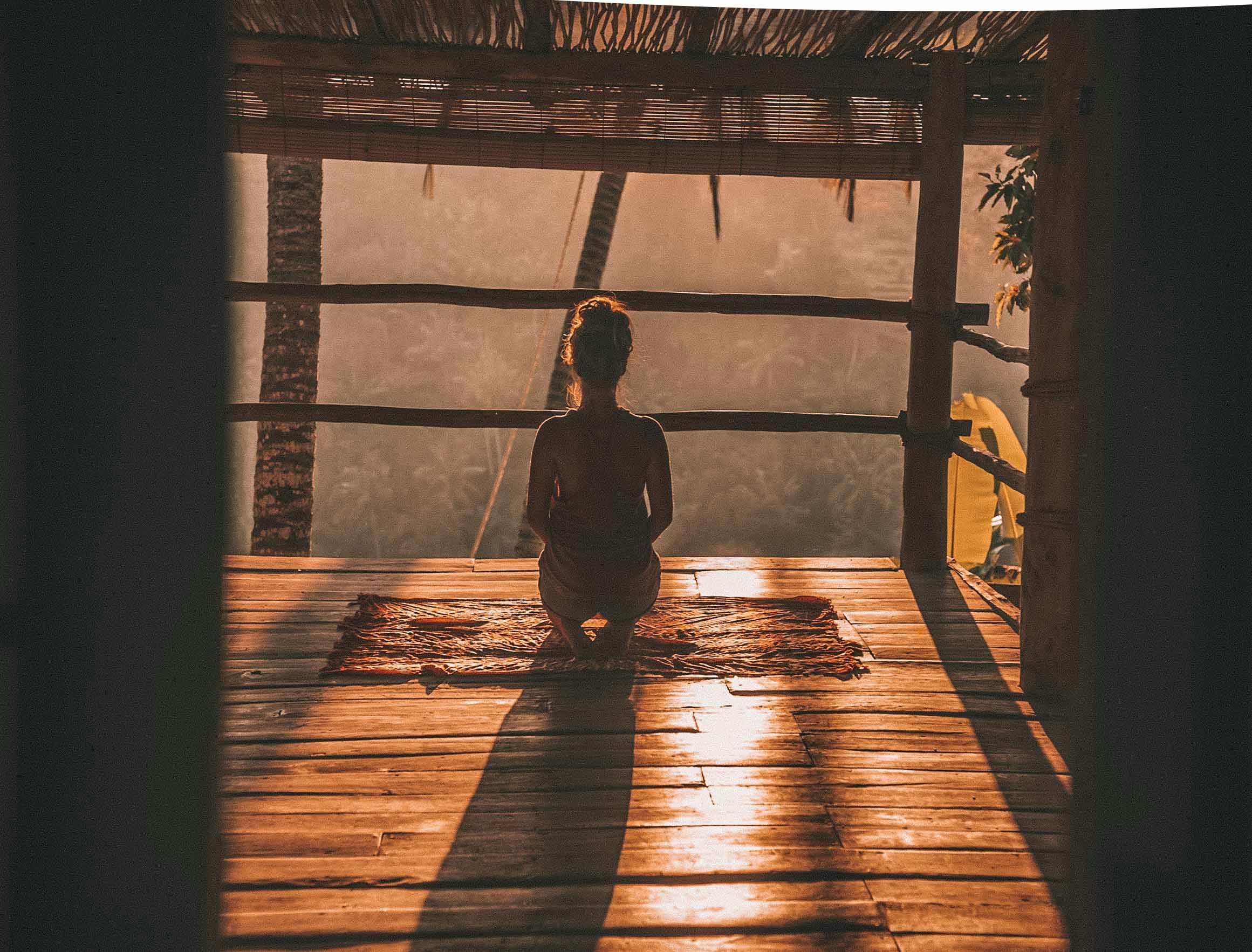 Photo by Unsplash An illustrative photo of a woman meditating on floor.