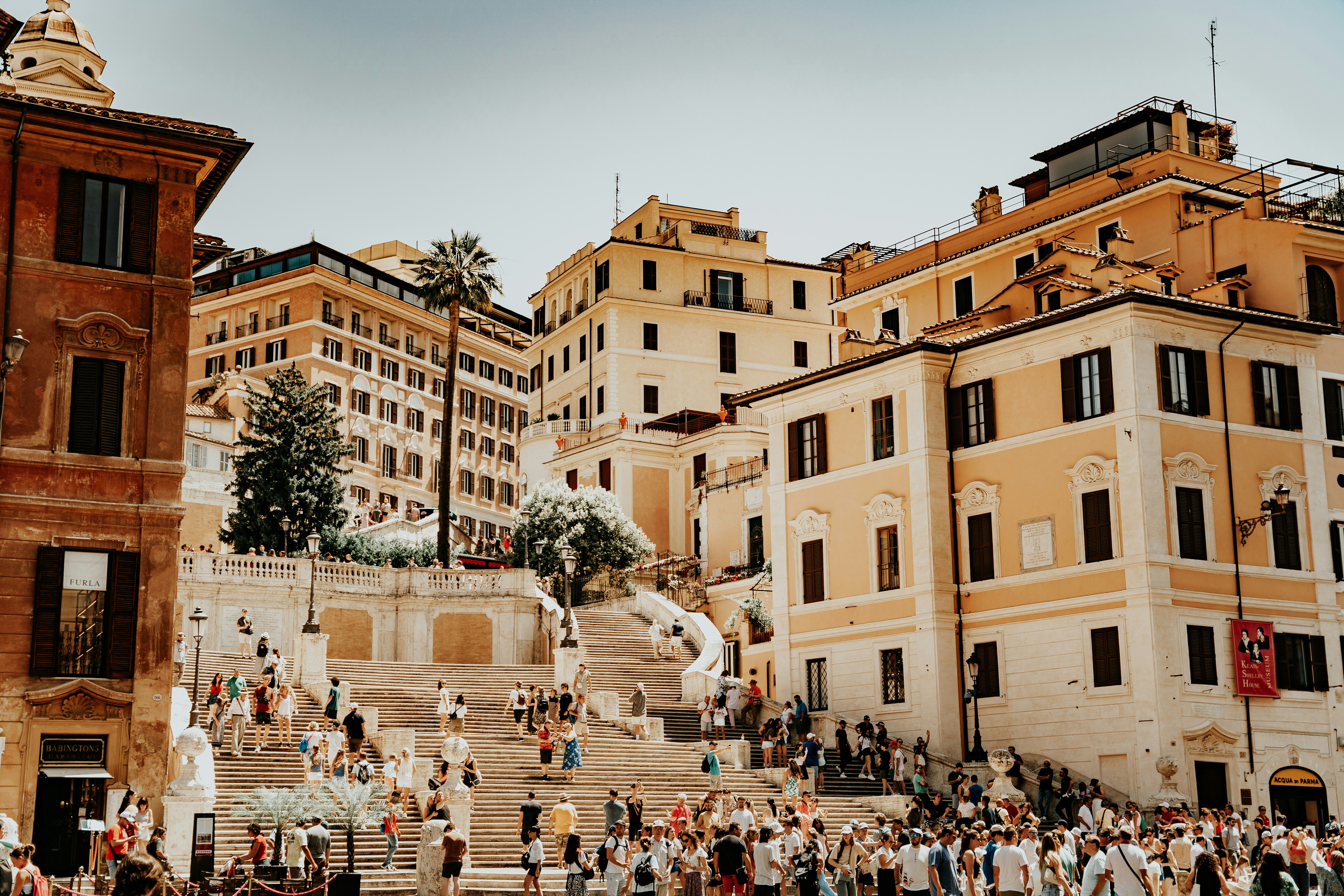 An illustrative photo of people walking on Spanish steps