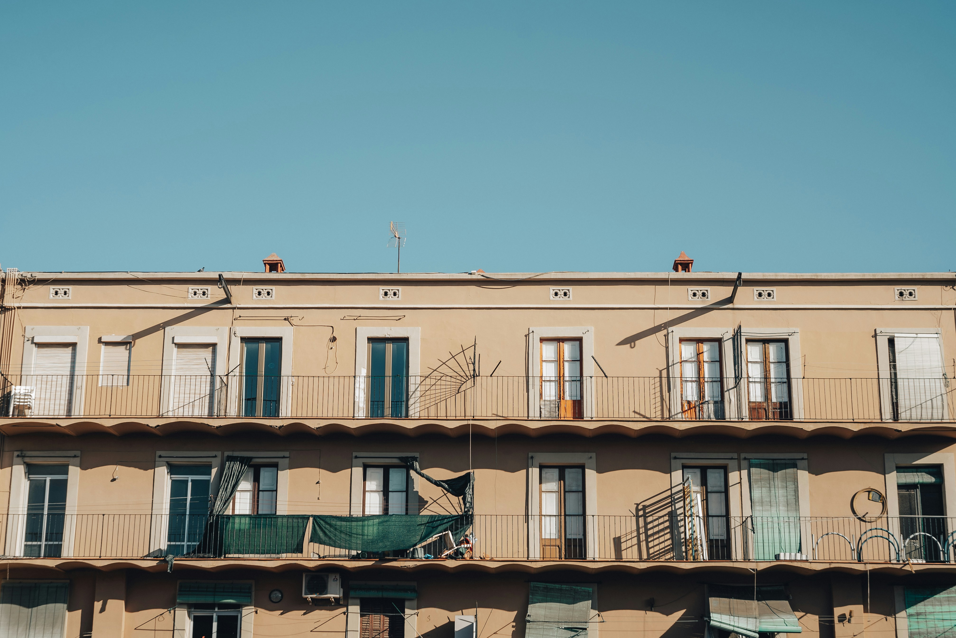 Photo by Unsplash An illustrative photo of a beige concrete building under blue sky during daytime