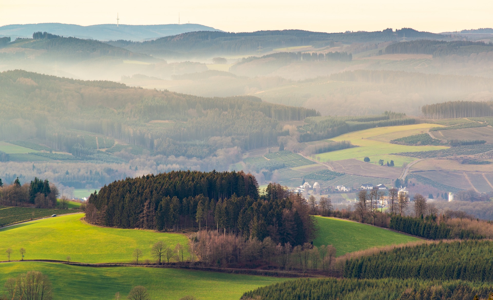 An illustrative photo of a foggy landscape with mountains