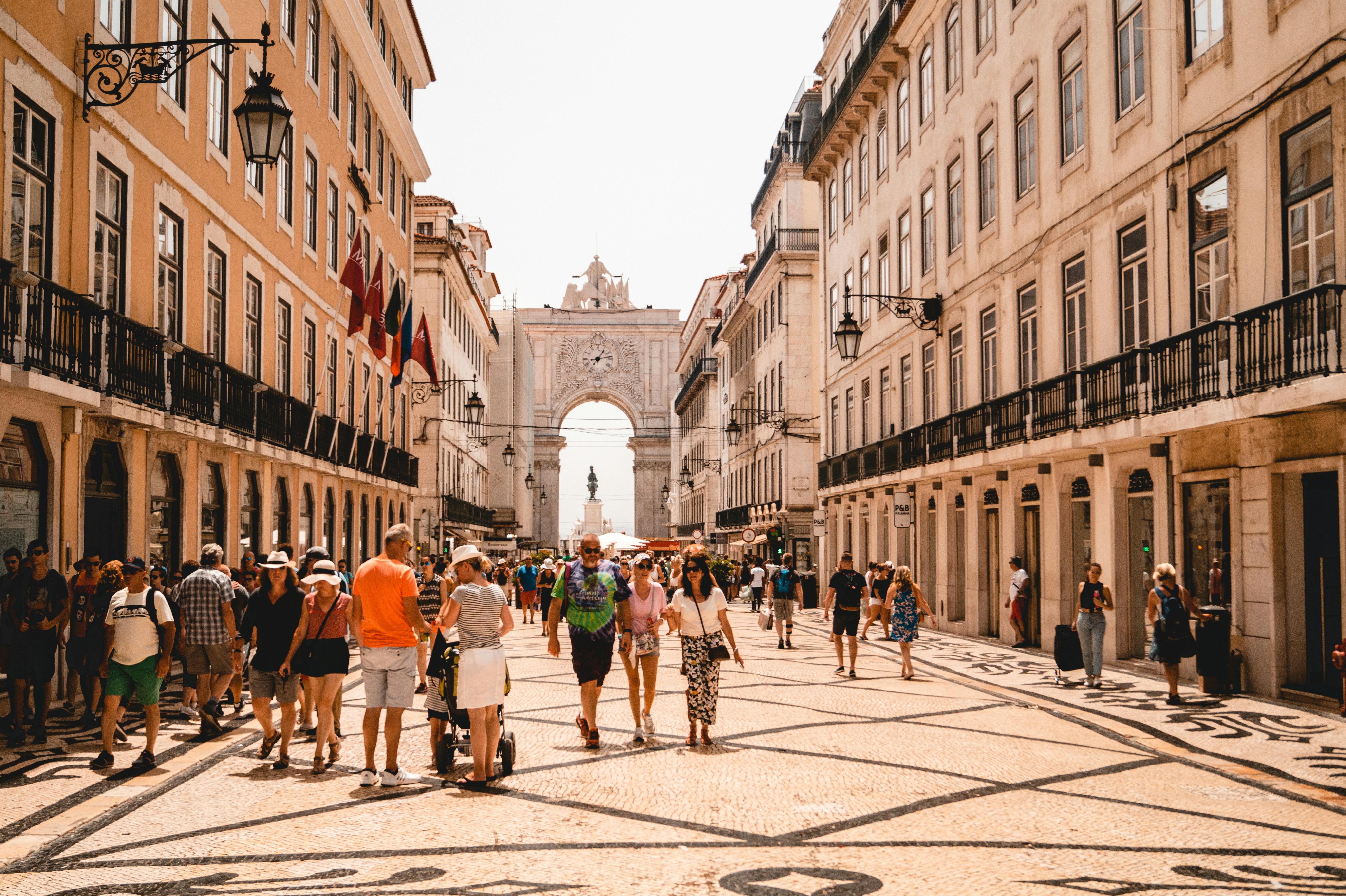 An illustrative photo of people walking on street in Lisbon