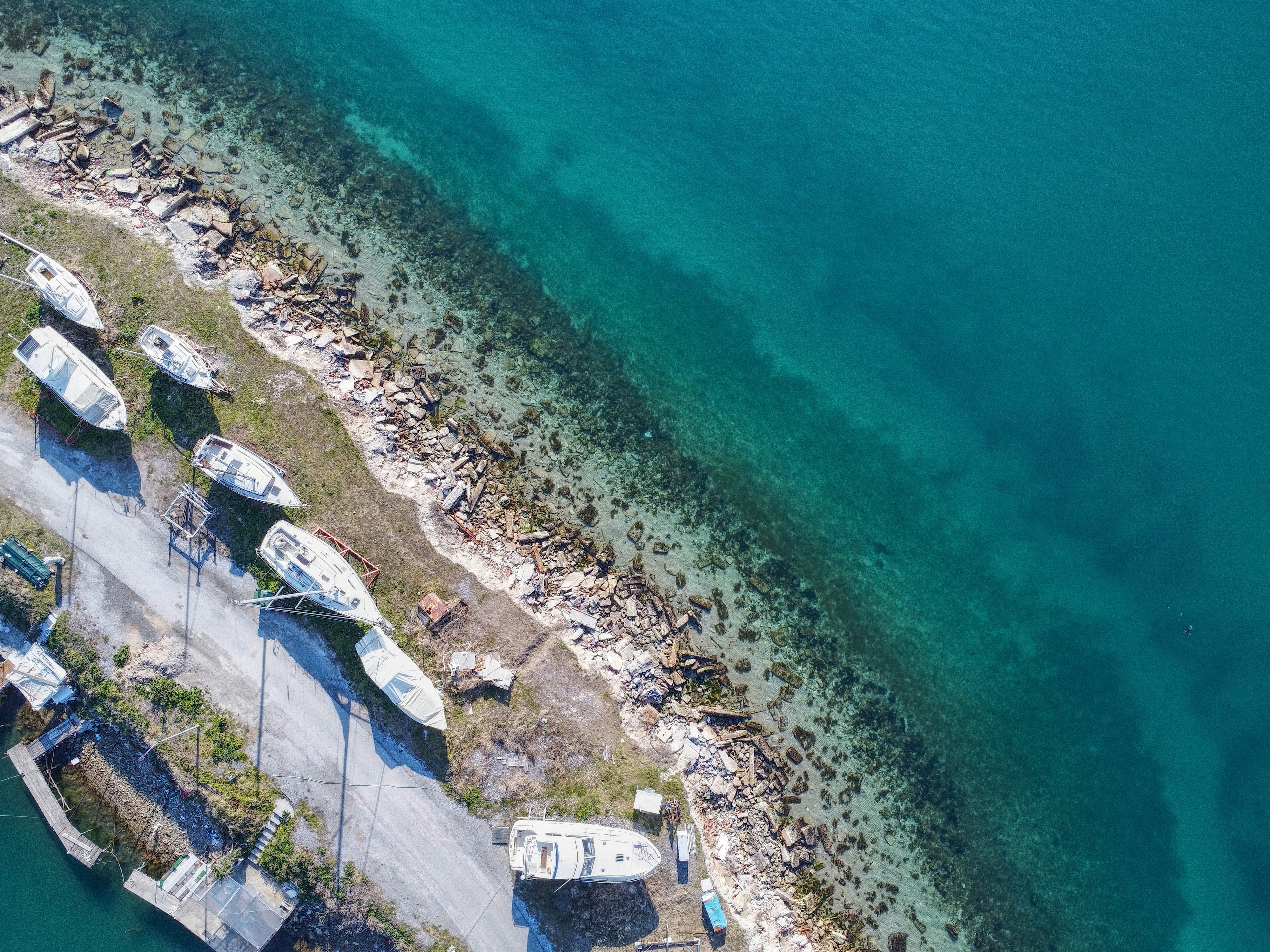 Photo by Unsplash An illustrative photo of several boats docked at a pier
