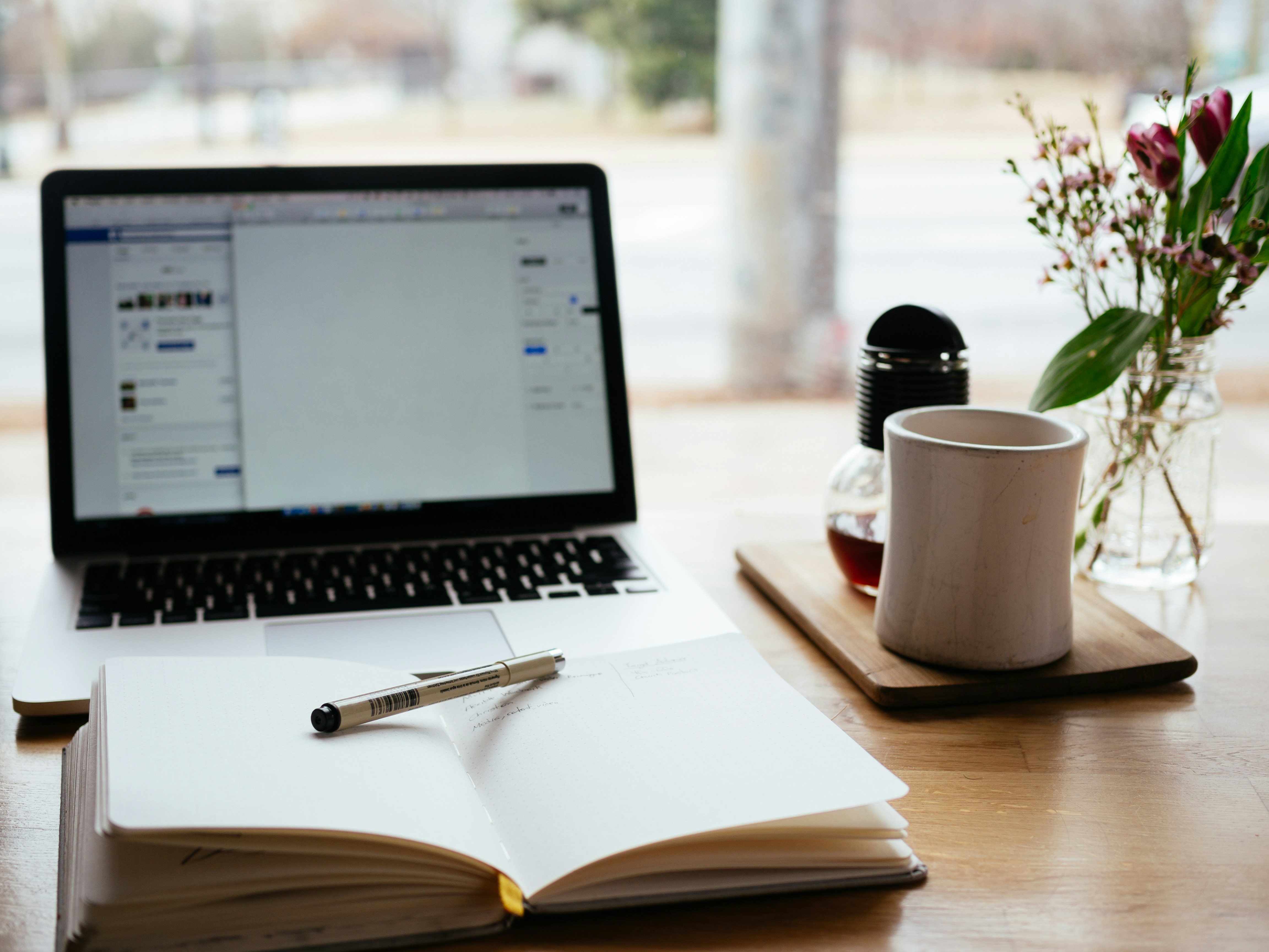 An illustrative photo of a laptop near the window