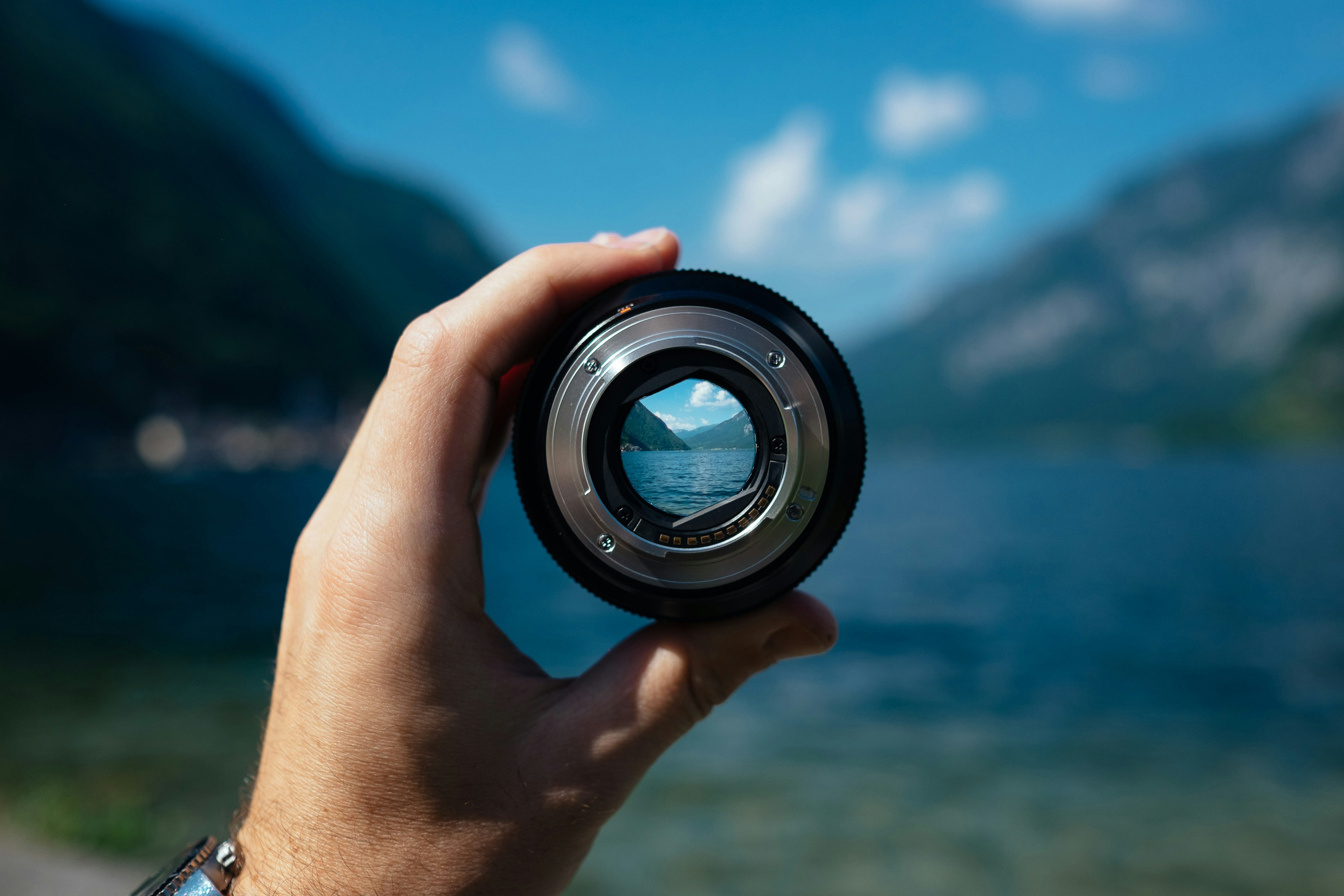 Photo by Unsplash An illustrative photo of a person holding a camera lens