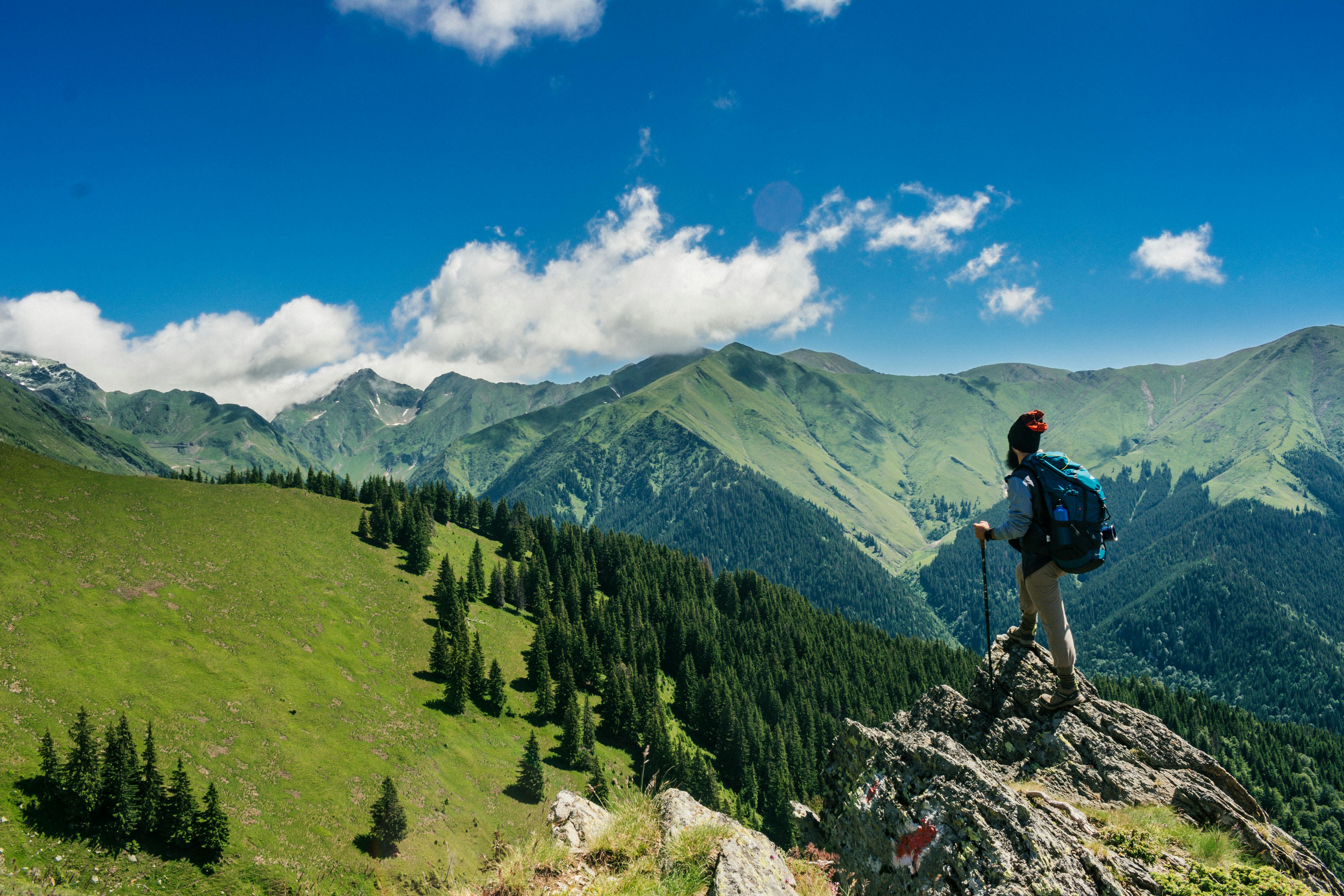 An illustrative photo of a man standing on a rock