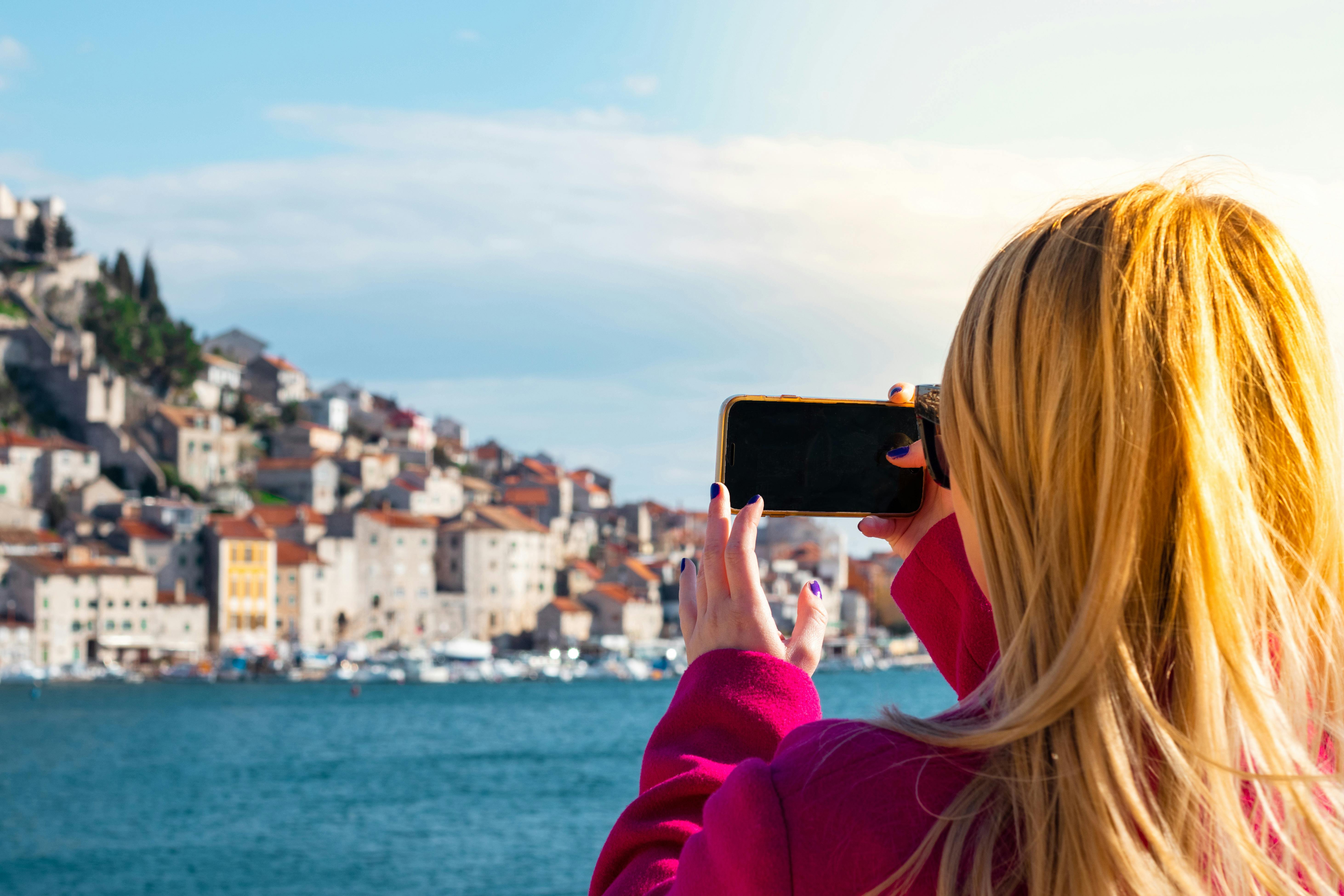 An illustrative photo of a woman taking a photo