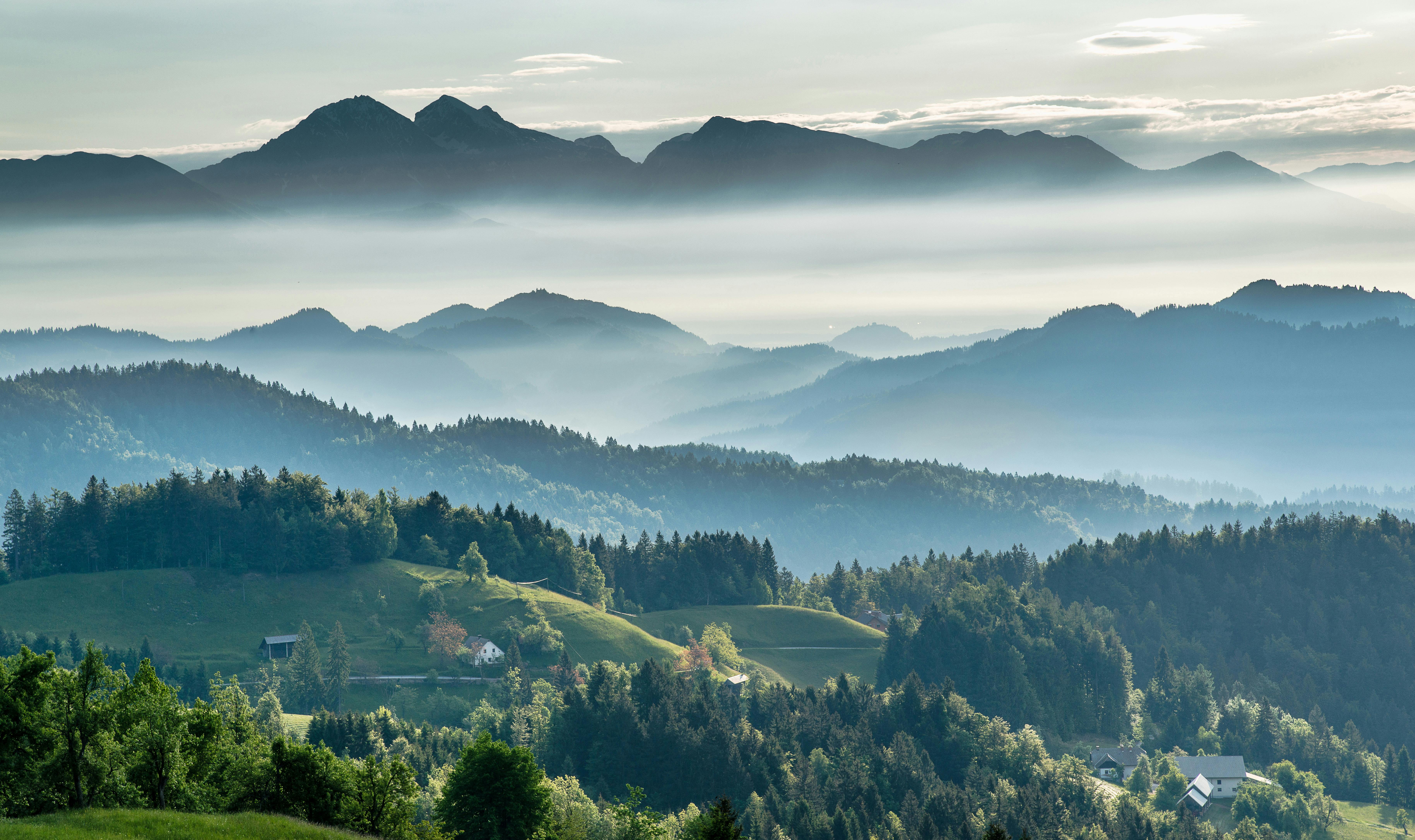 An illustrative photo of mountains covered by fog