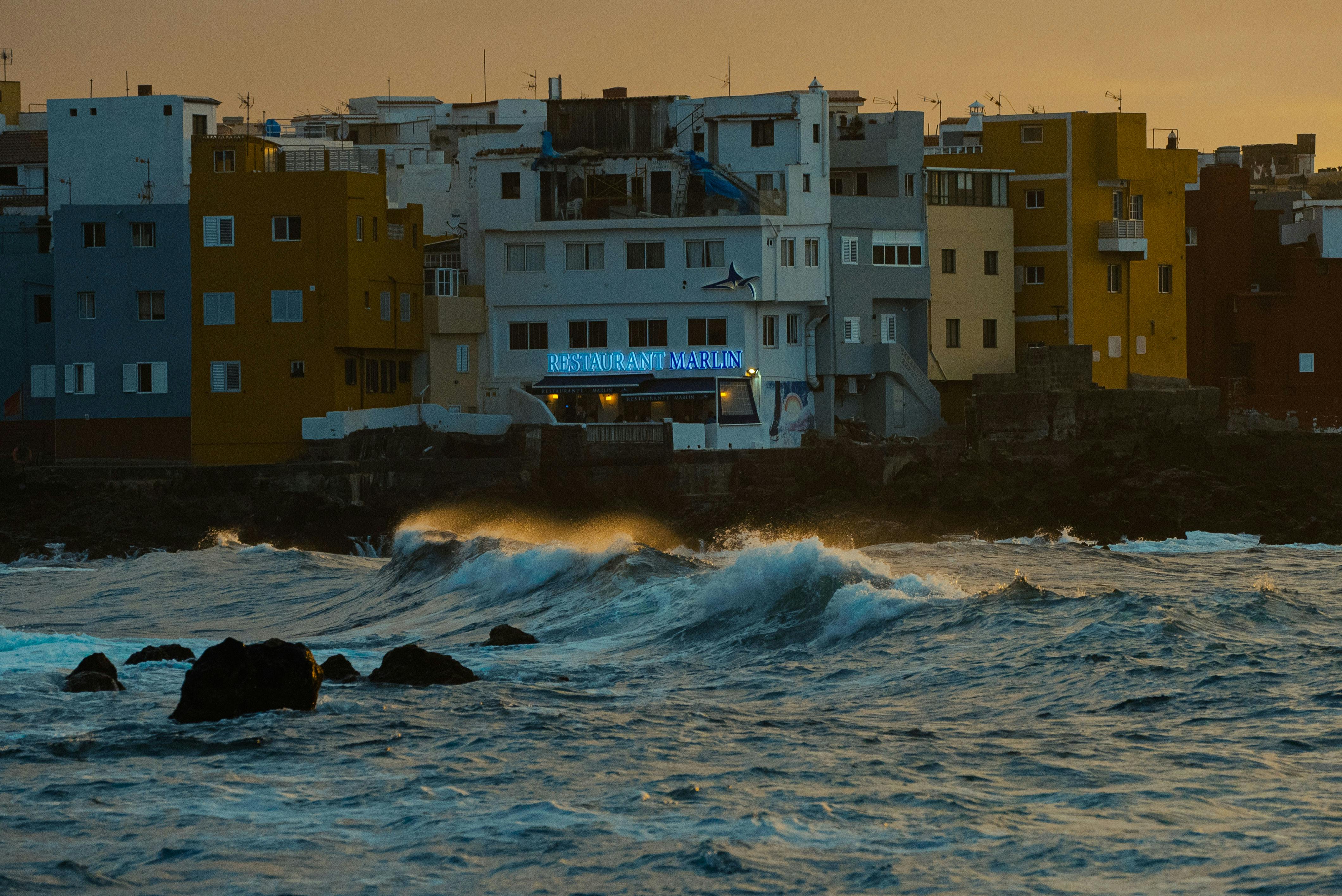 An illustrative photo of waterfront buildings on the shore.