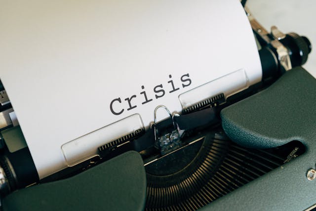 Photo by Pexels An illustrative photo of a vintage typewriter with a sheet of white paper inserted and word "Crysis" typed on it