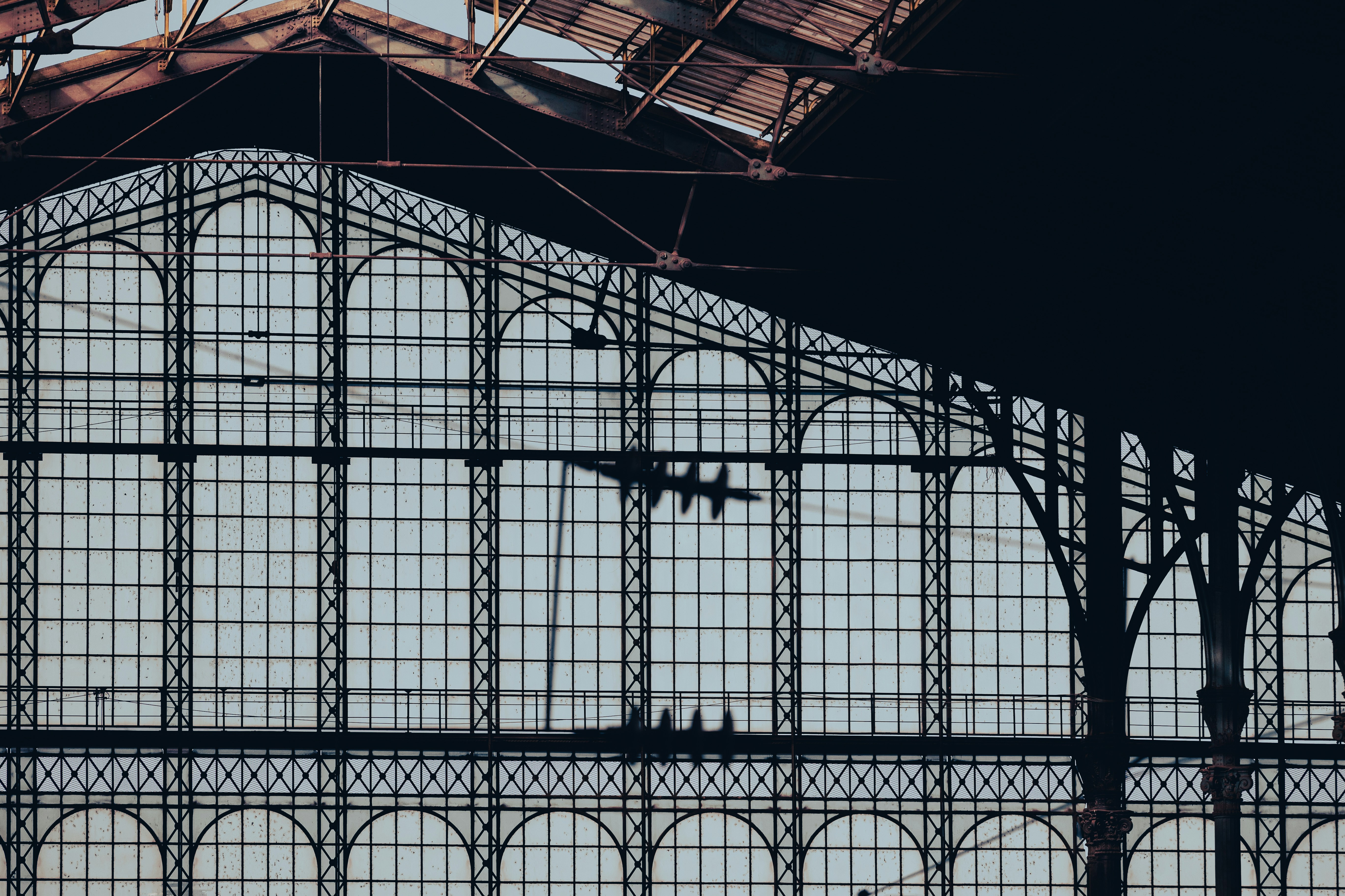 An illustrative photo of a train station with a train on the tracks