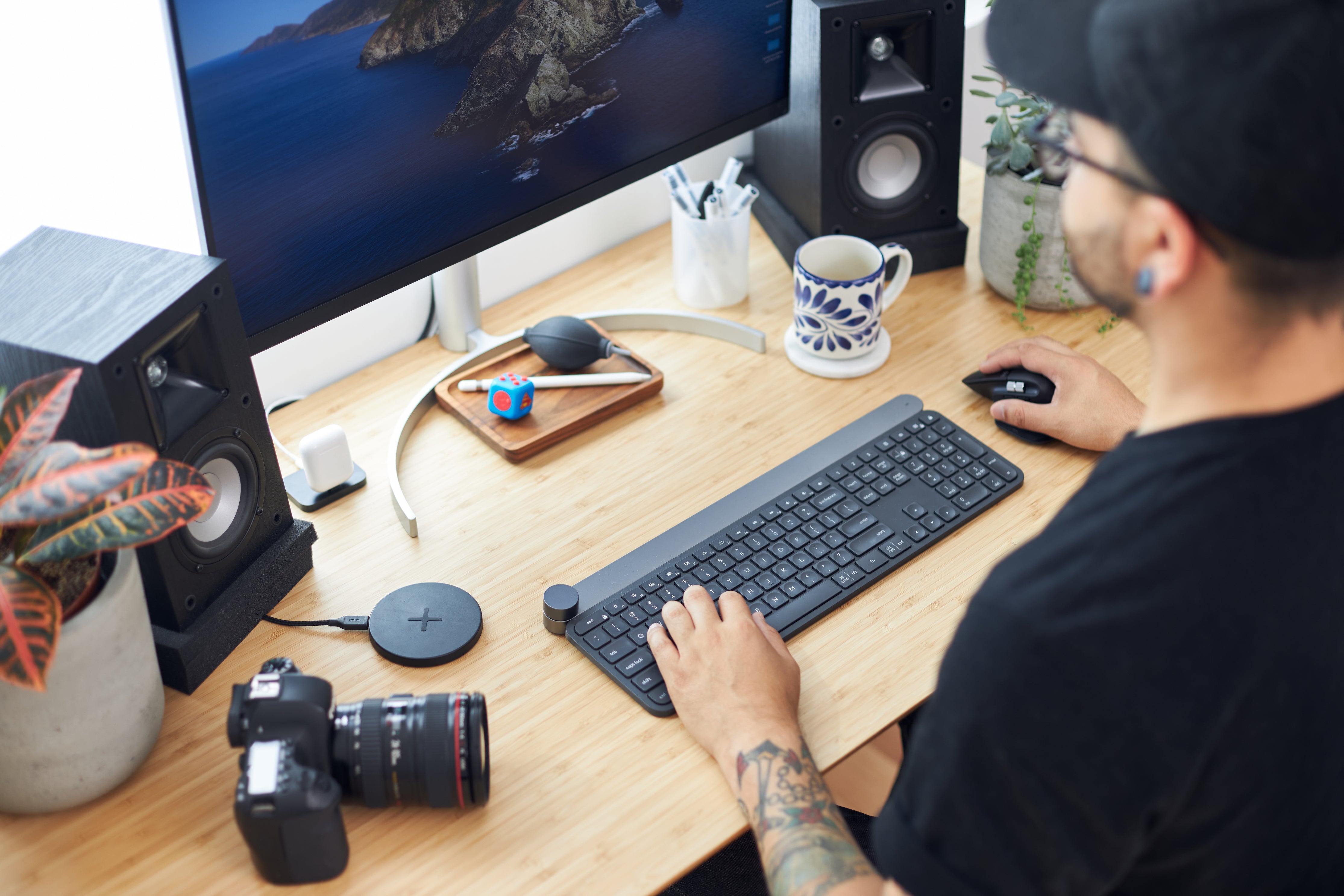 An illustrative photo of a photographer working at his desk