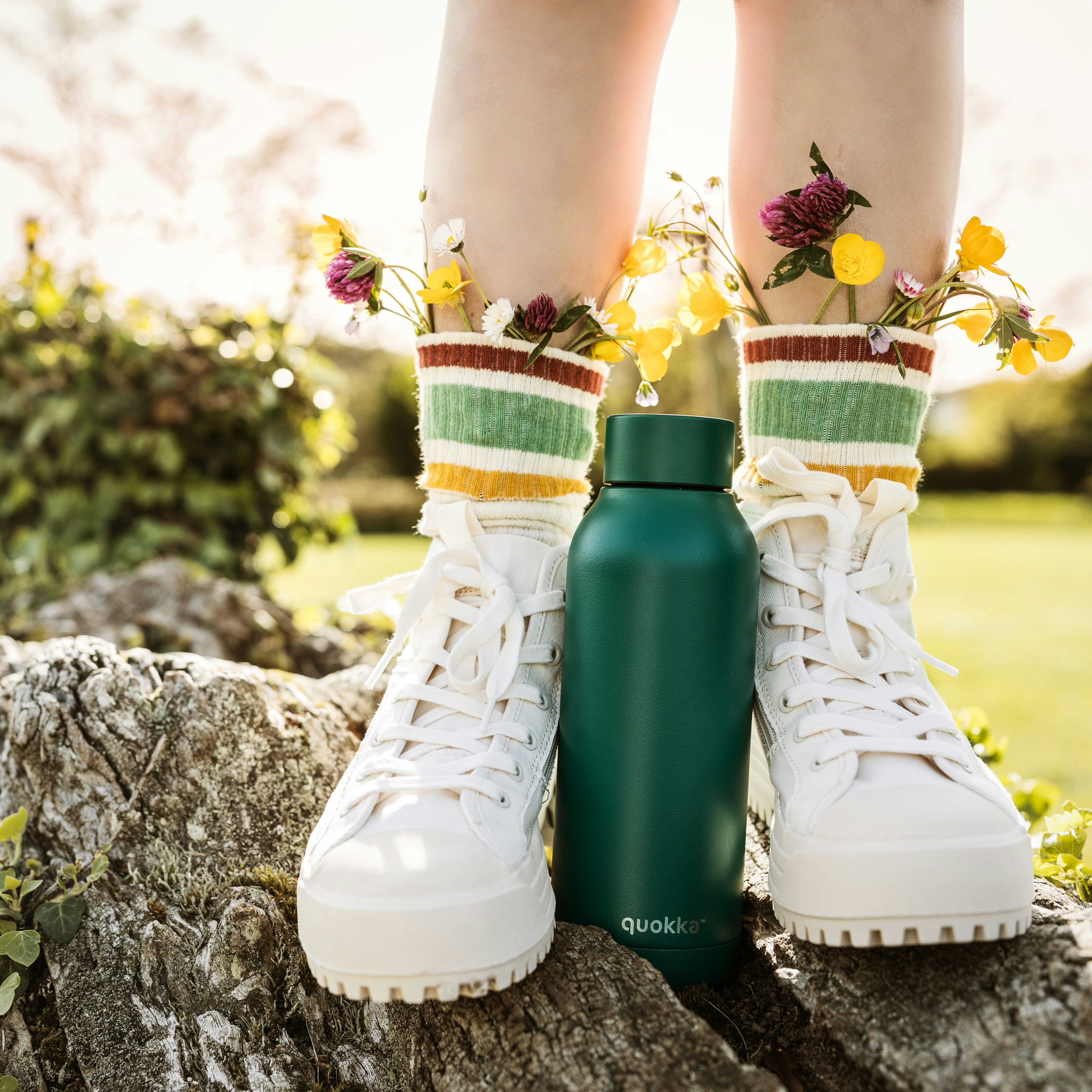 An illustrative photo of a person wearing white and yellow floral rain boots