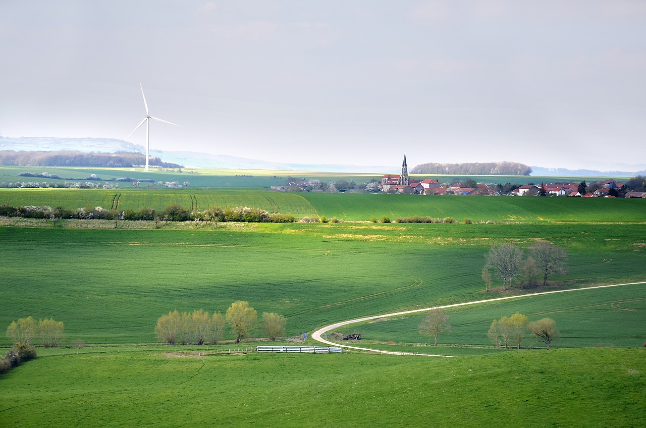 An illustrative photo of a windmill on the green field