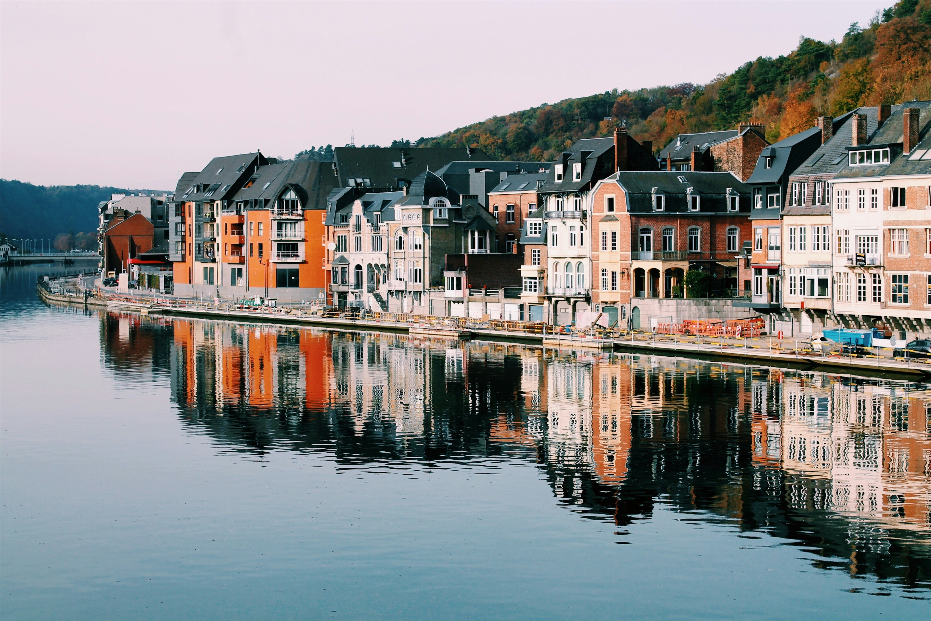 An illustrative photo of houses of different colours near the lake