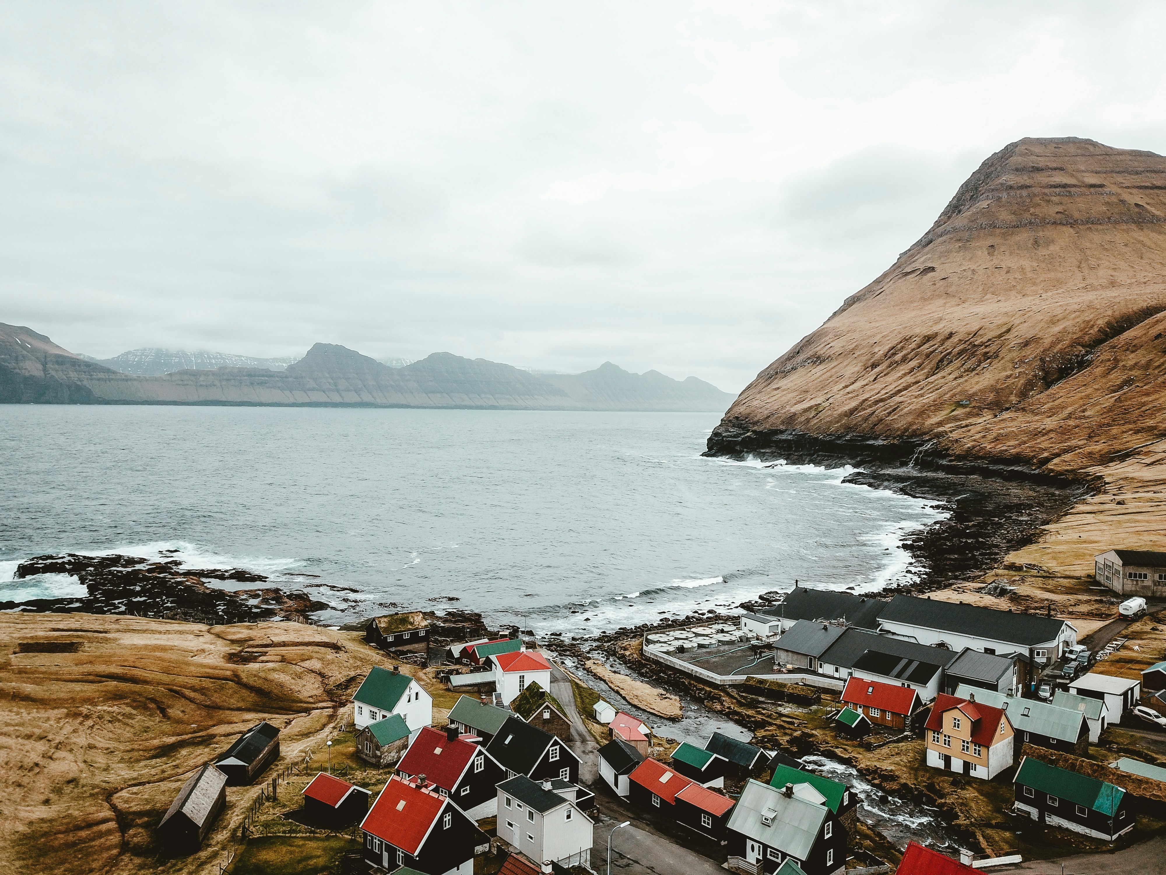 An illustrative photo of houses on seashore 