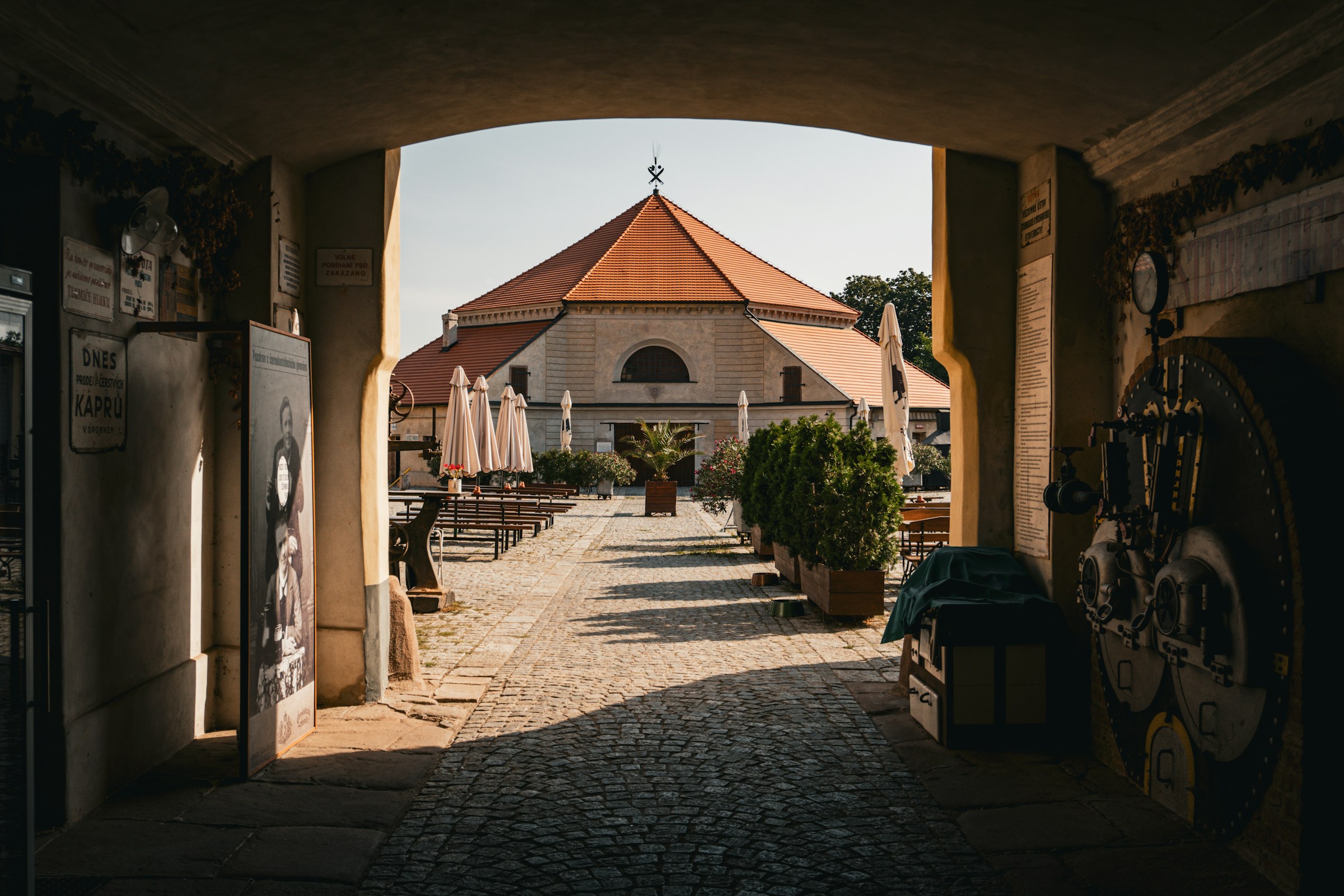 An illustrative photo of an archway leading to a building.