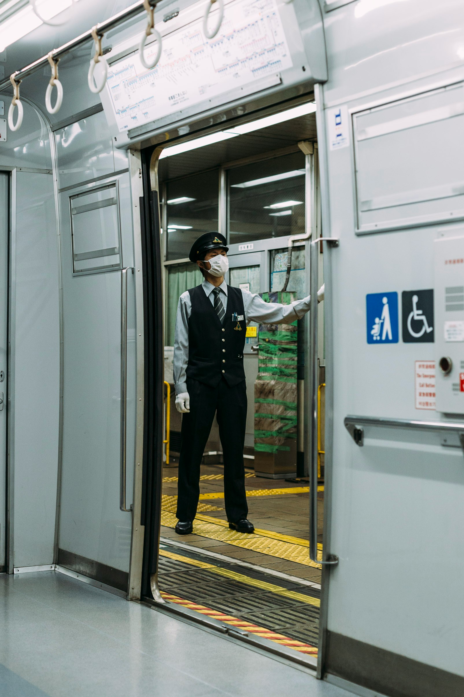 Photo by Unsplash An illustrative photo of a man in a mask standing on the train station