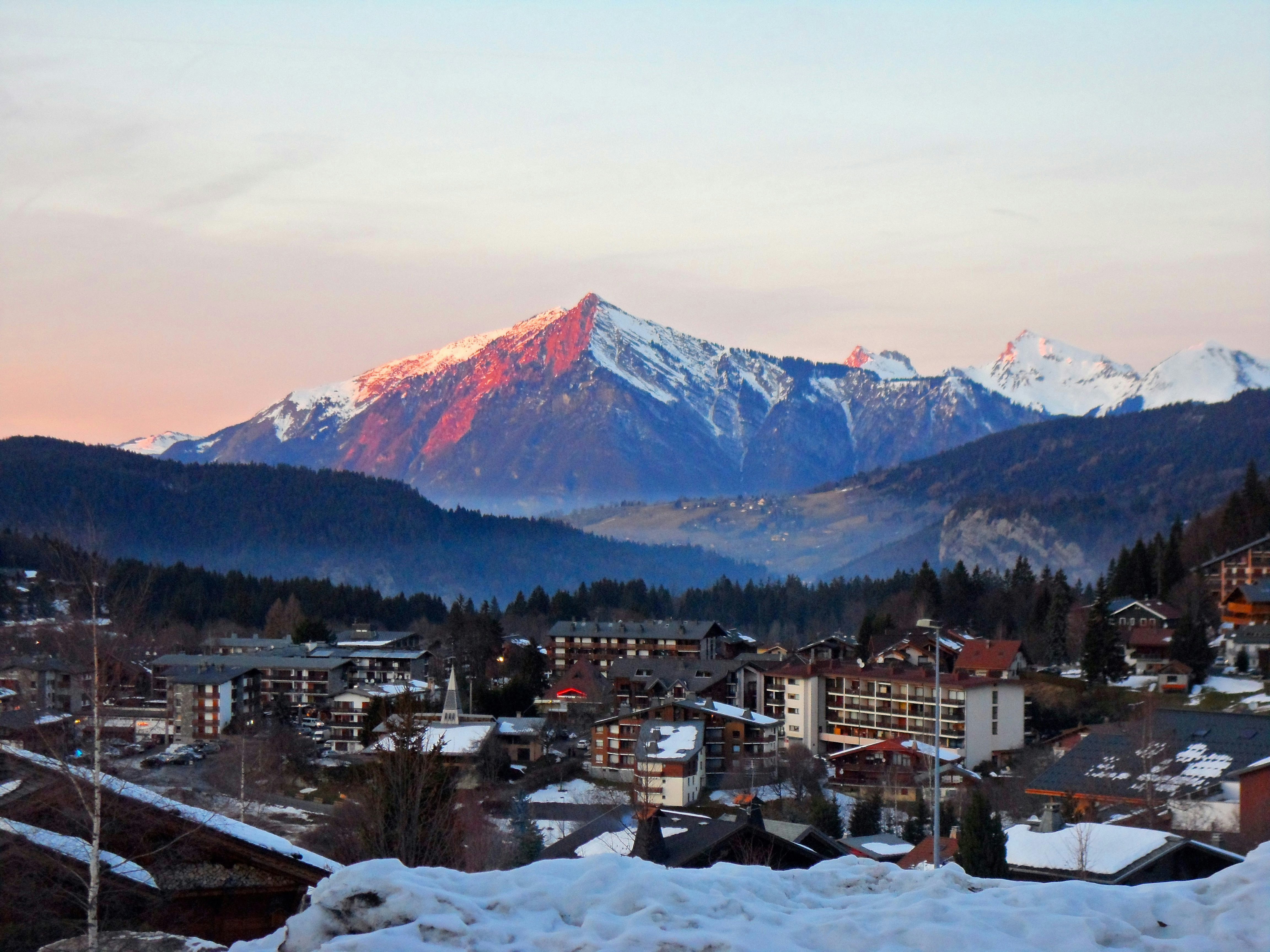 Photo by Unsplash An illustrative photo of a town with snow covered mountains in the background
