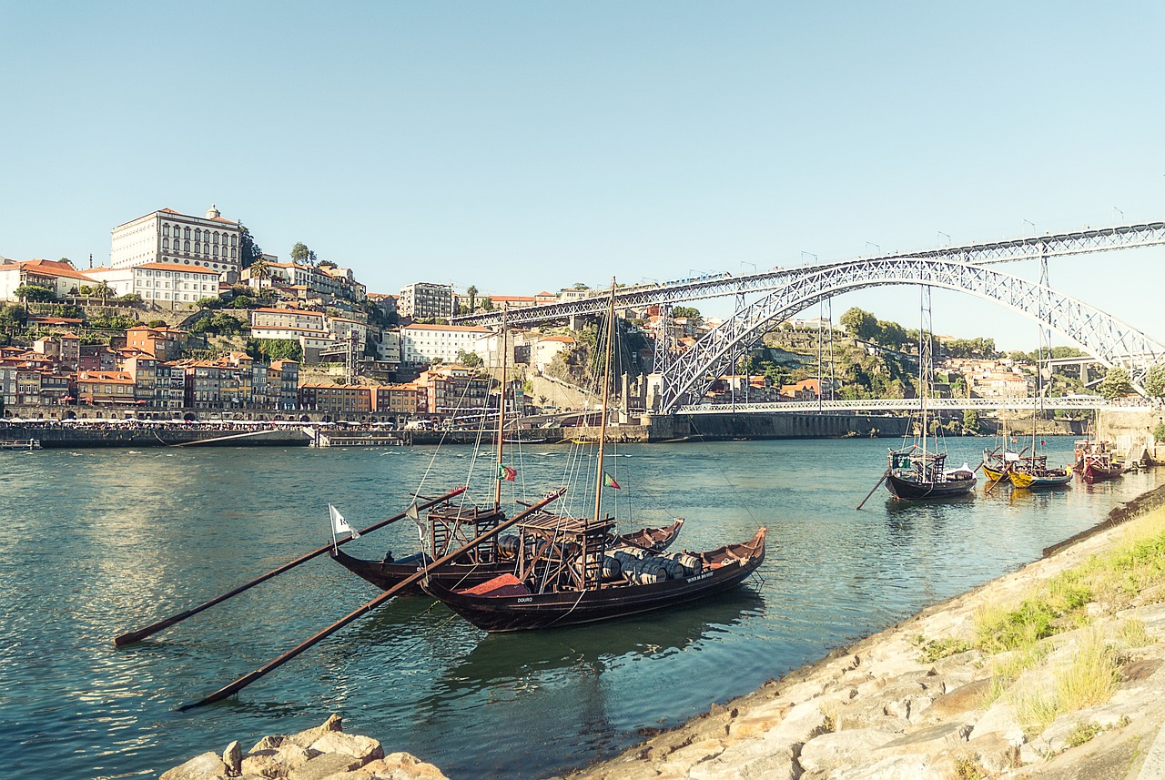 An illustrative photo of boats floating on the river in Porto, Portugal