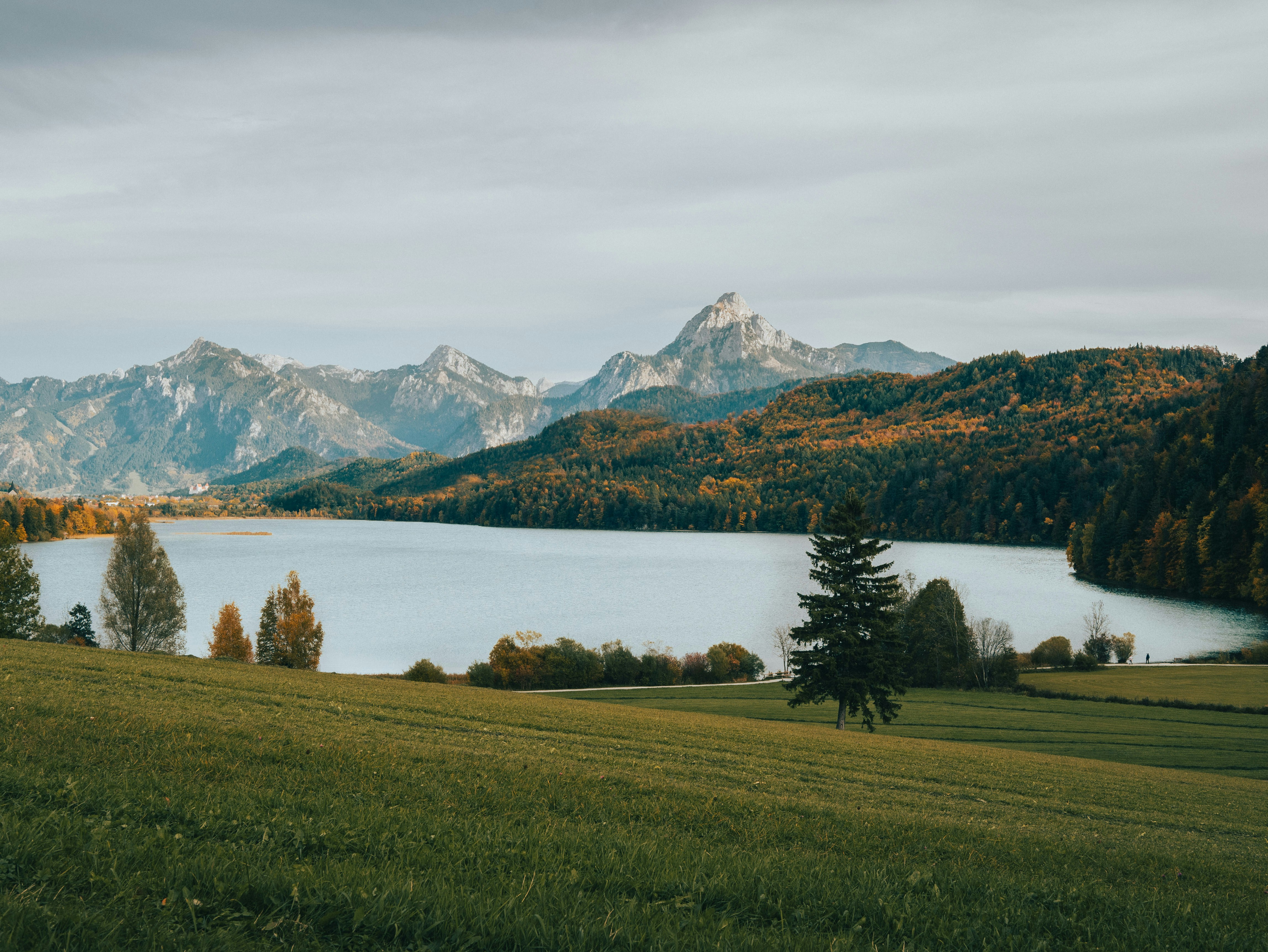 Photo by Unsplash An illustrative photo of a large body of water surrounded by mountains.