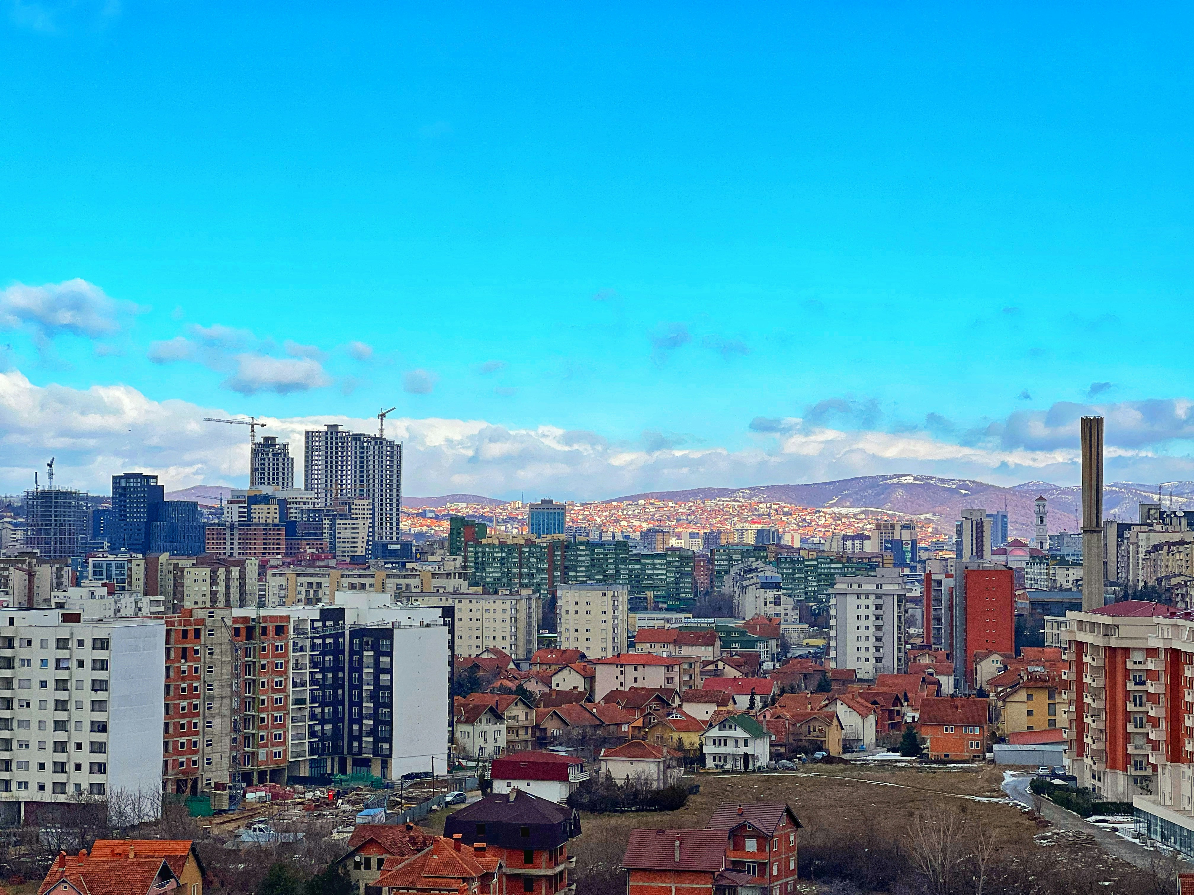 An illustrative photo of a view of a city in Kosovo with tall buildings