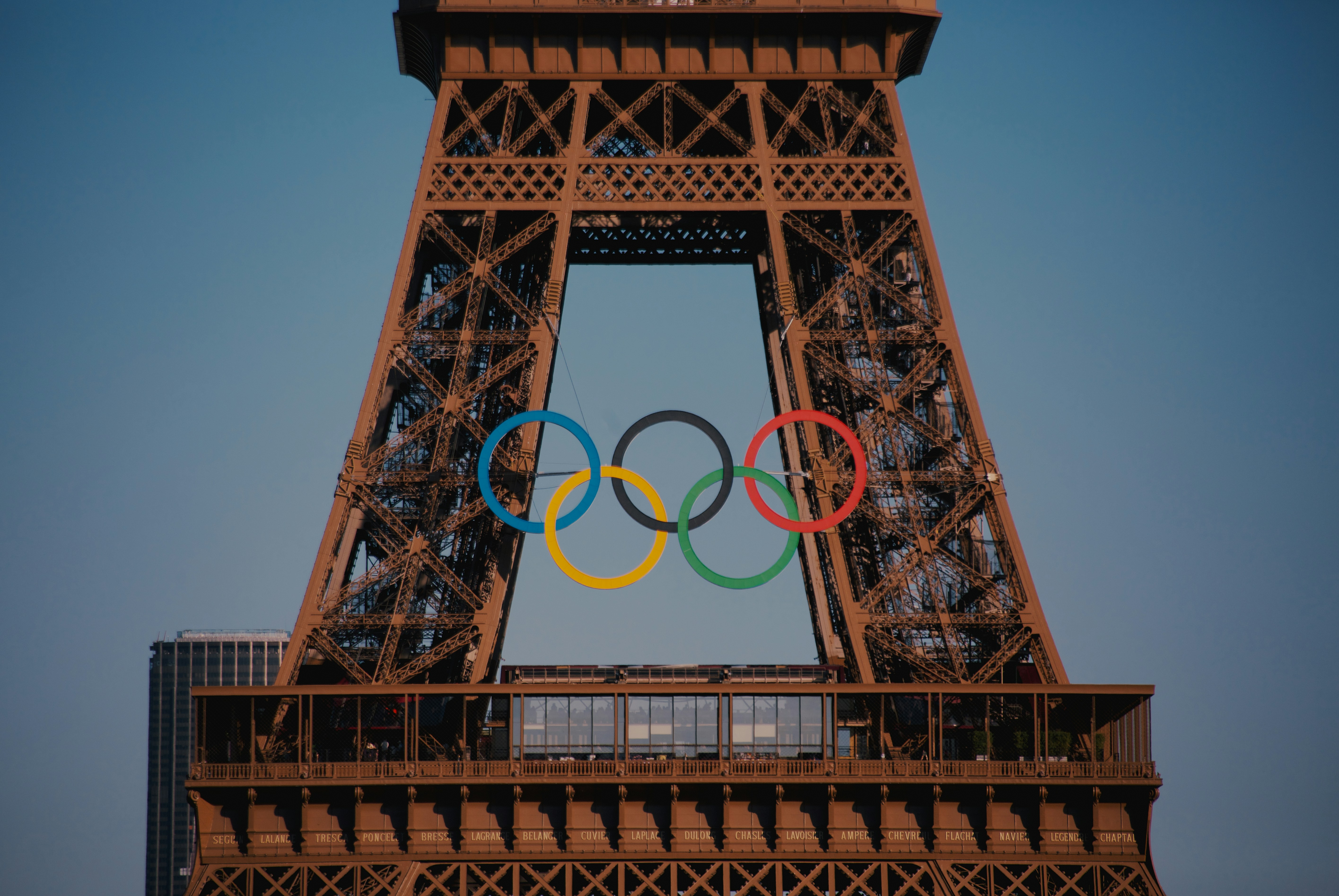 The eiffel tower with the olympic rings in front of it 