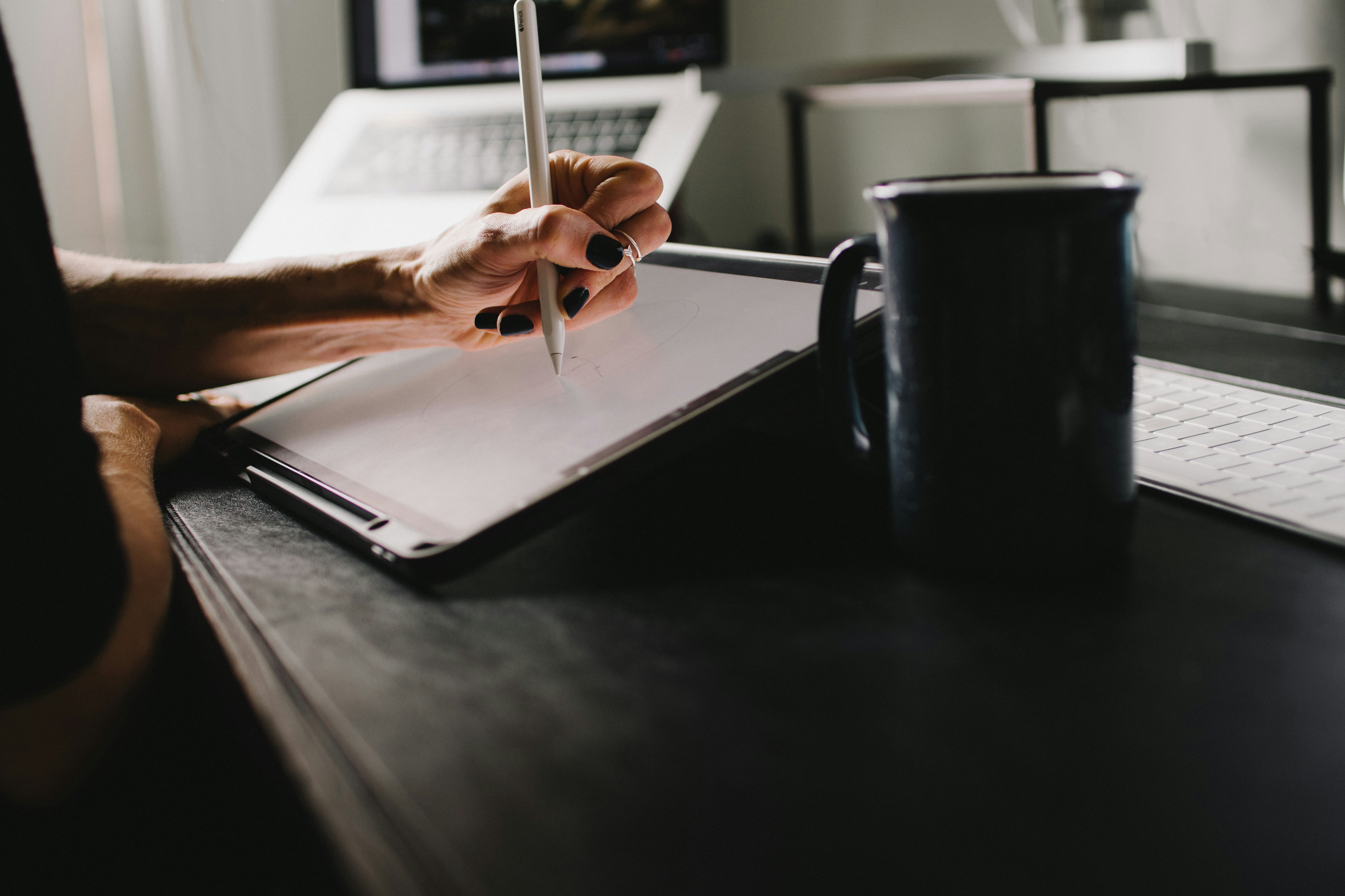 Photo by Unsplash An illustrative photo of a person writing on an iPad