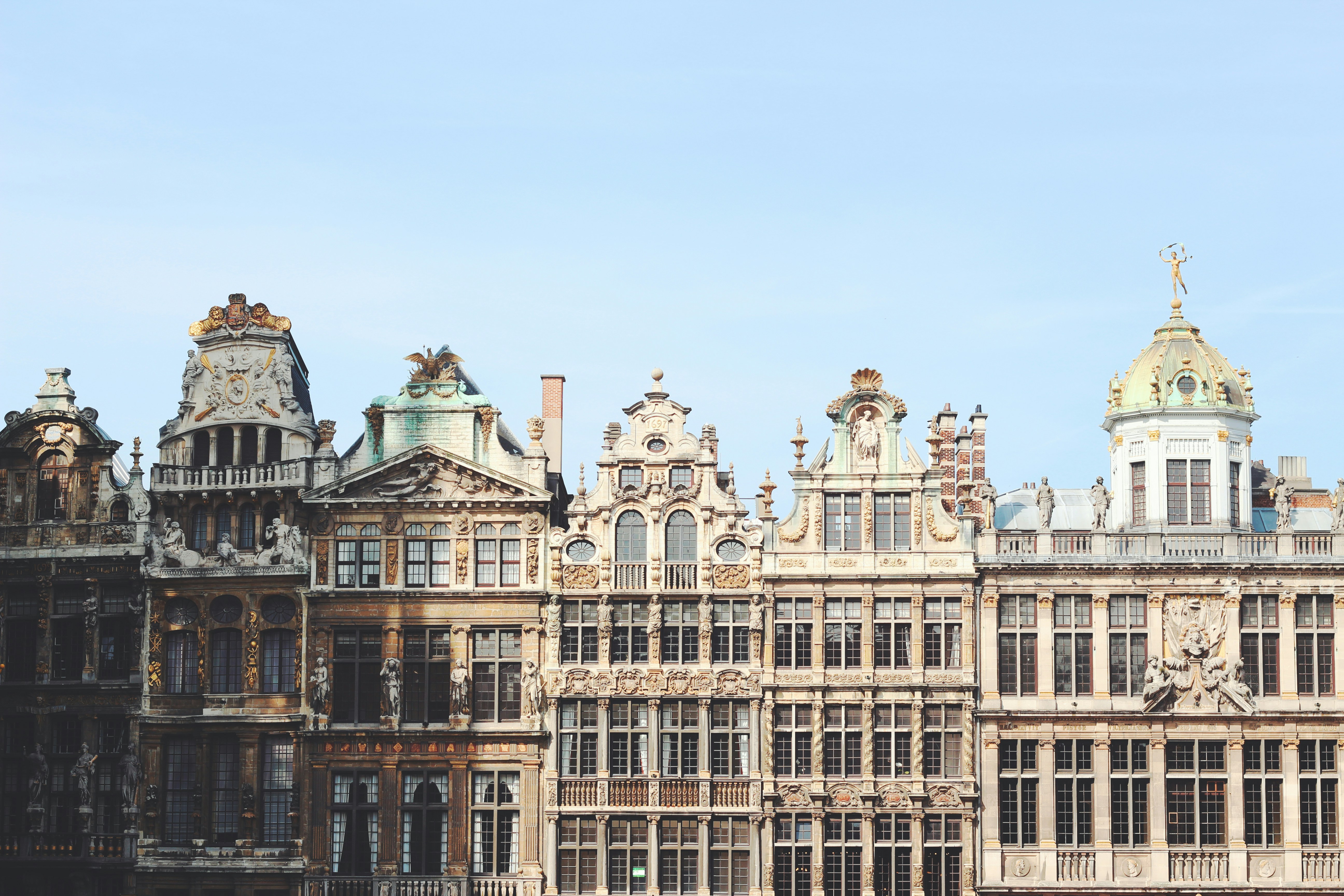 Gray and brown building under blue sky