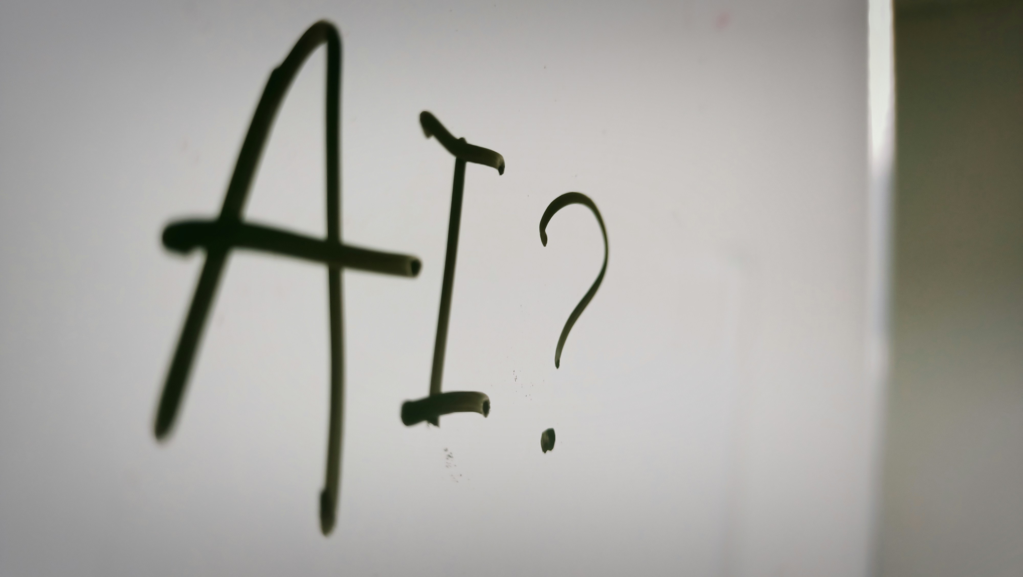 An illustrative photo of a sign with a question mark.