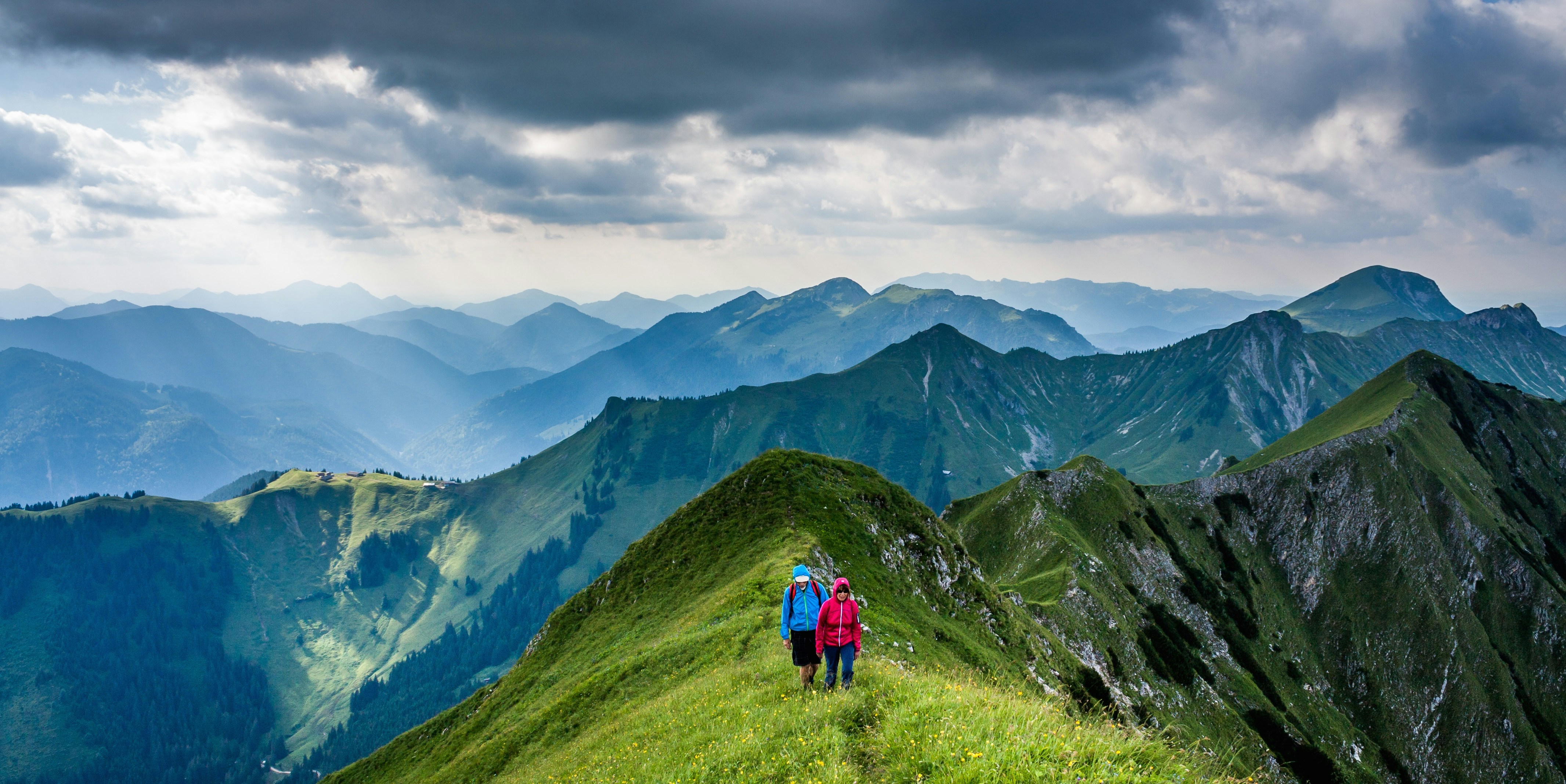 Photo by Unsplash An illustrative photo of people walking on top of mountain