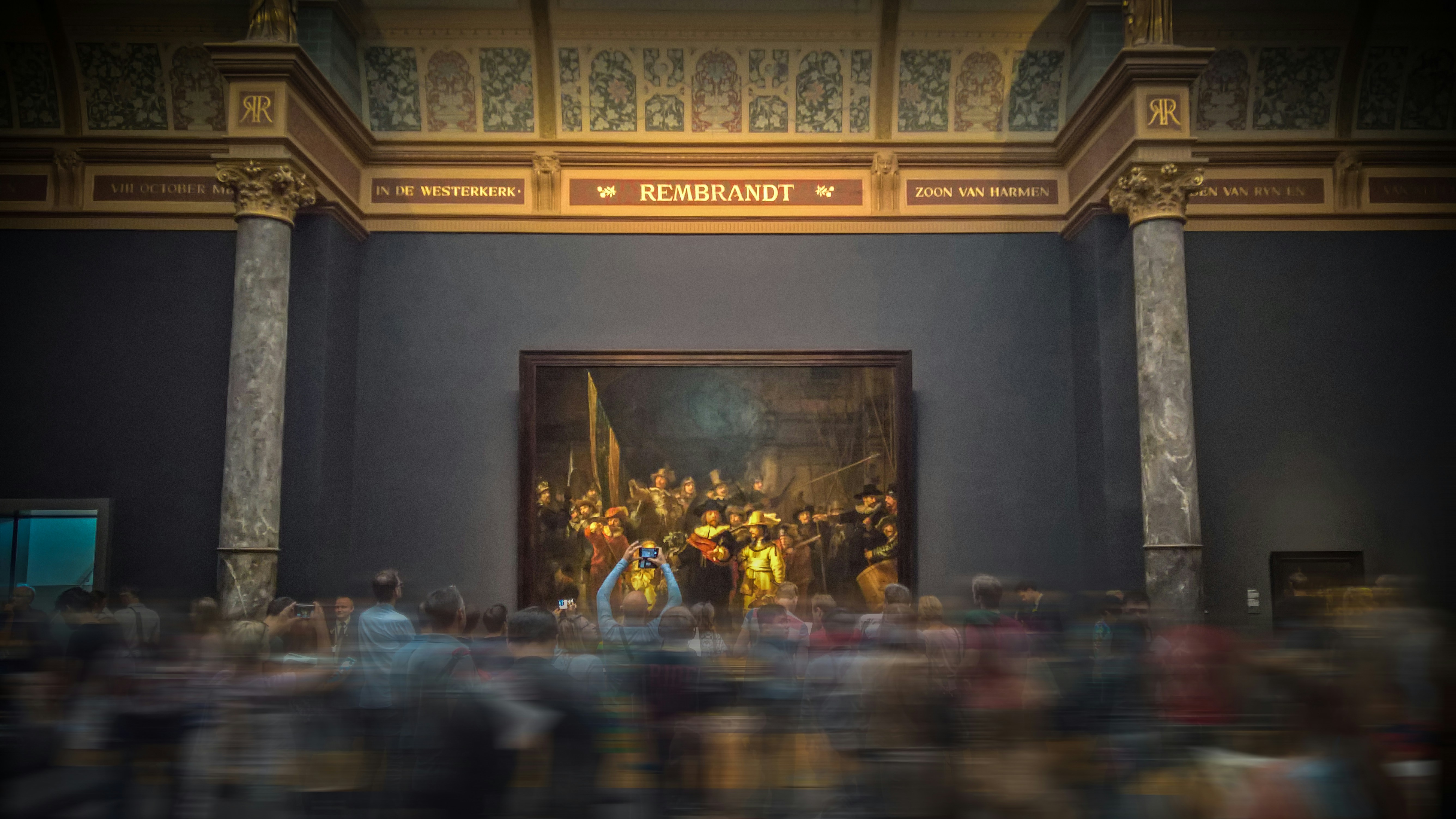 Photo by Unsplash An illustrative photo of people looking at a painting in a museum