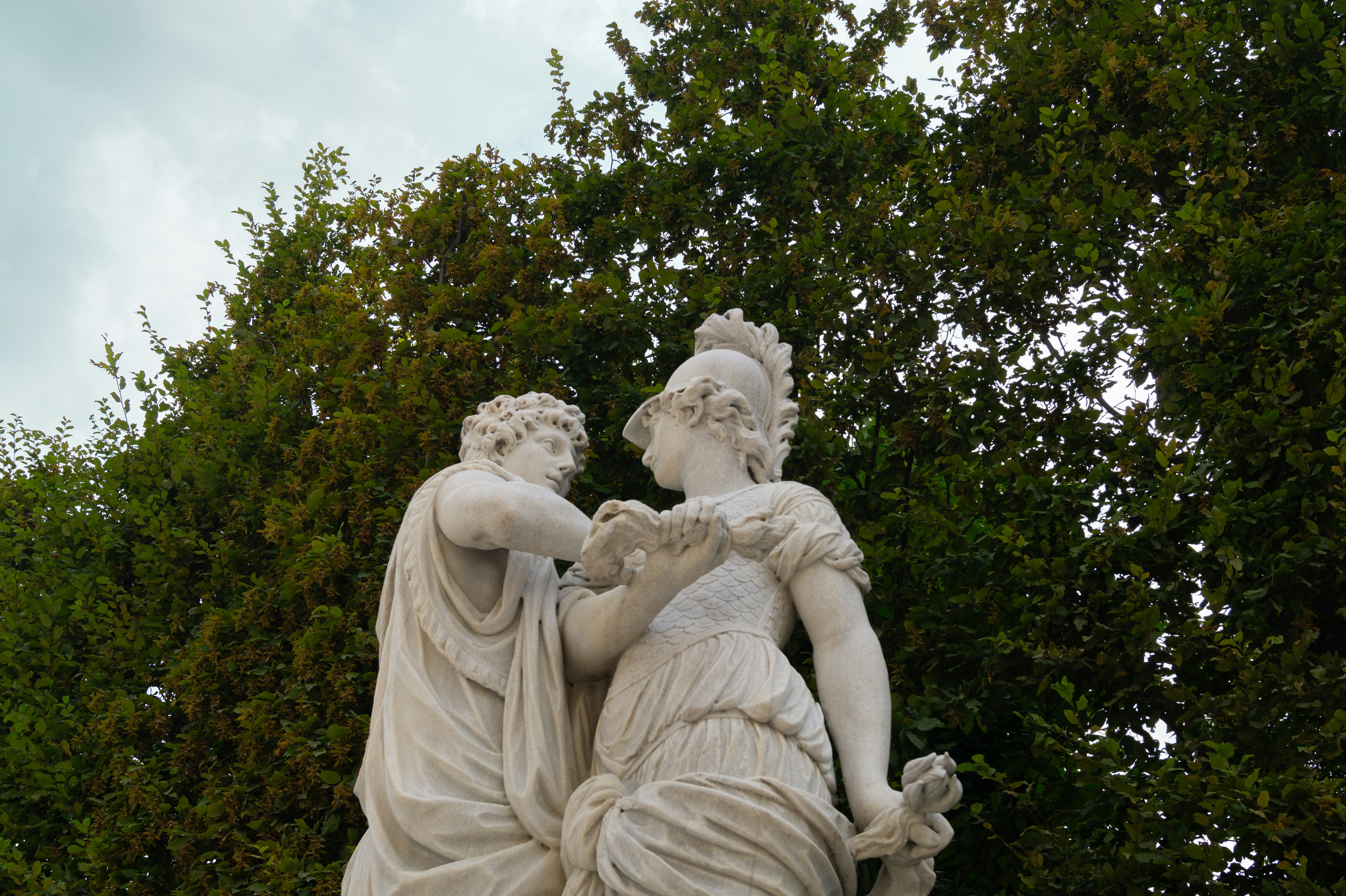 An illustrative photo of a statue of a man and a woman.