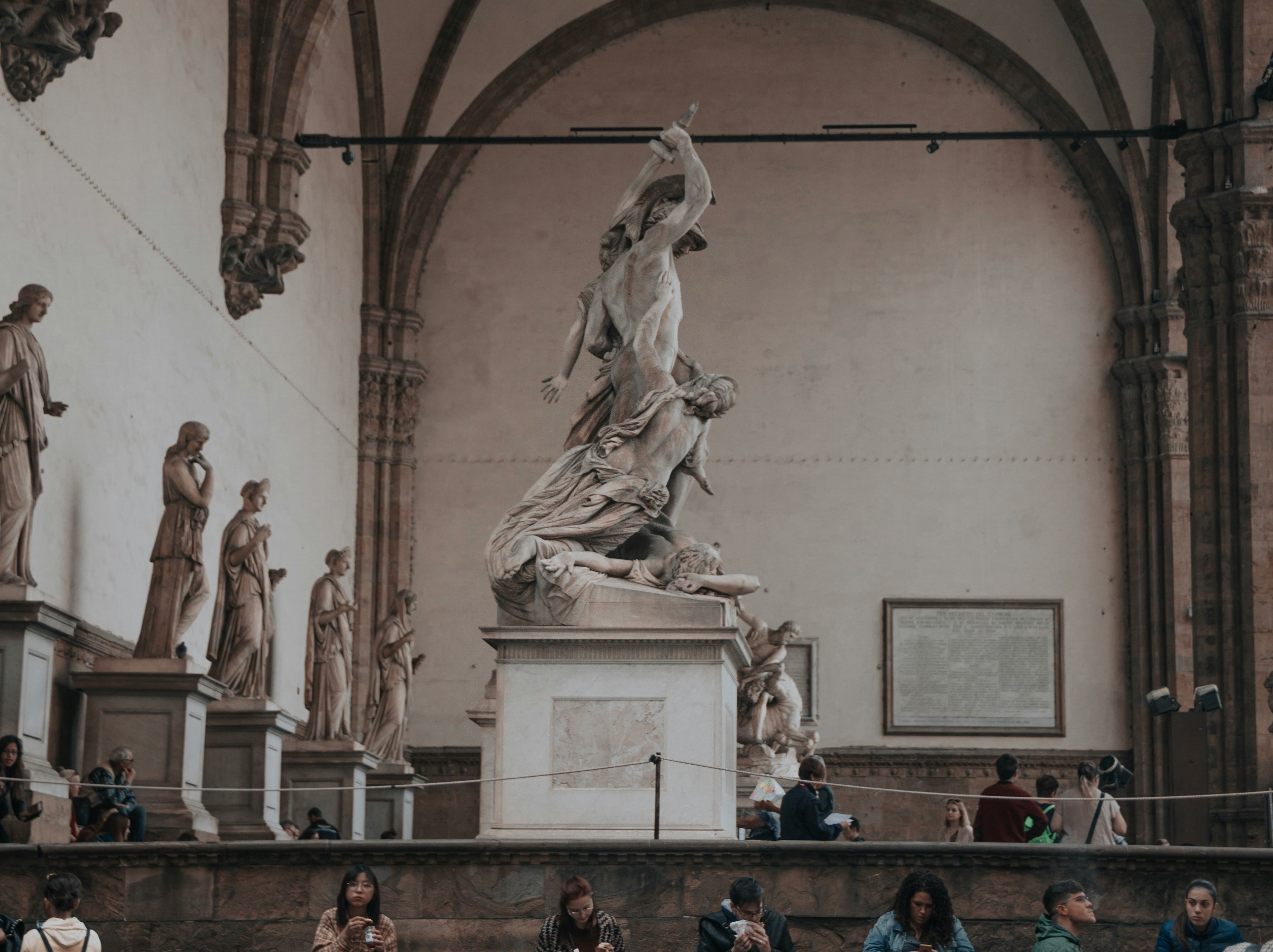 An illustrative photo of a white concrete statue.