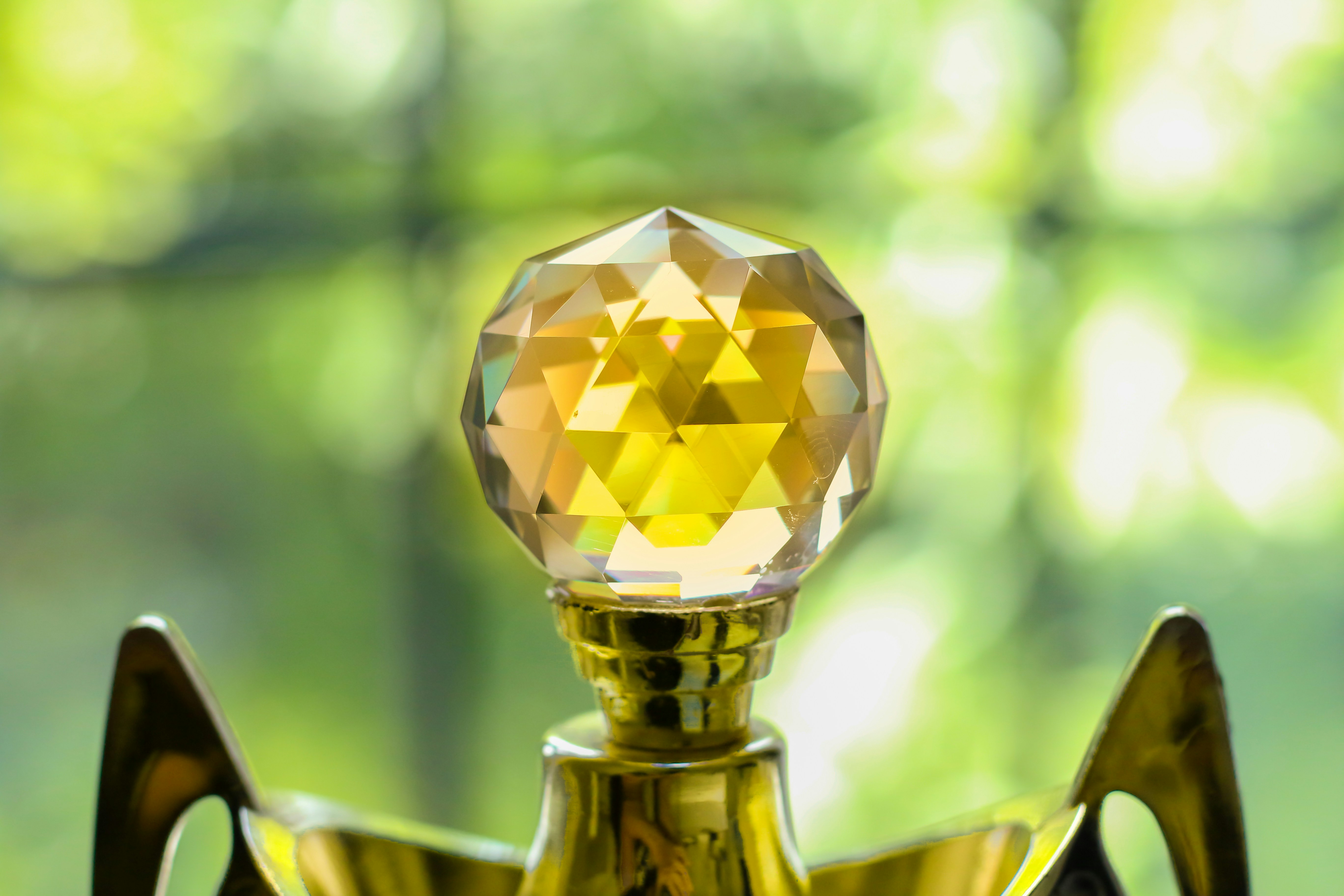 Photo by Unsplash An illustrative photo of a golden metal trophy with a crystal ball on top of it