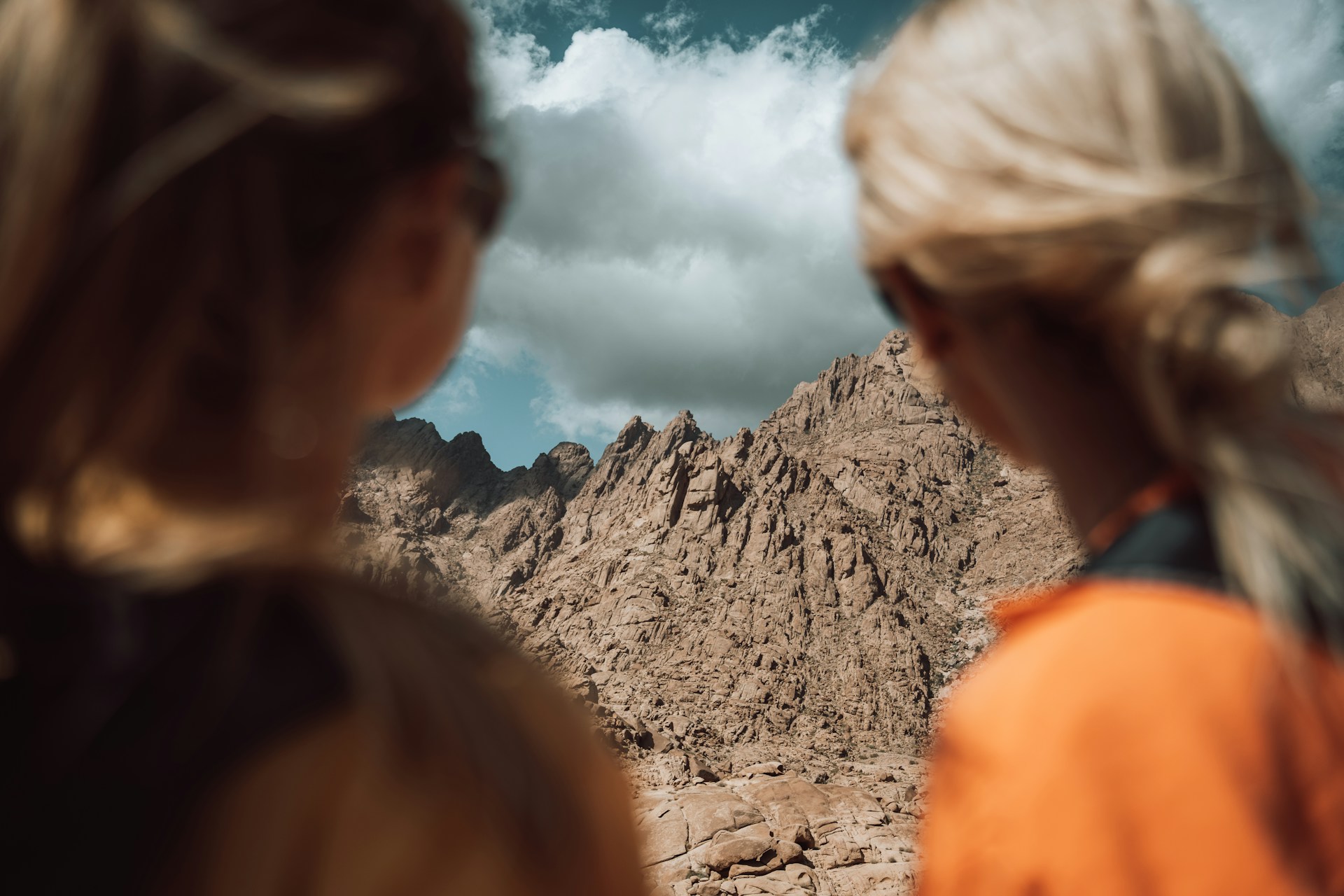 An illustrative photo of two women looking at the rocky mountain