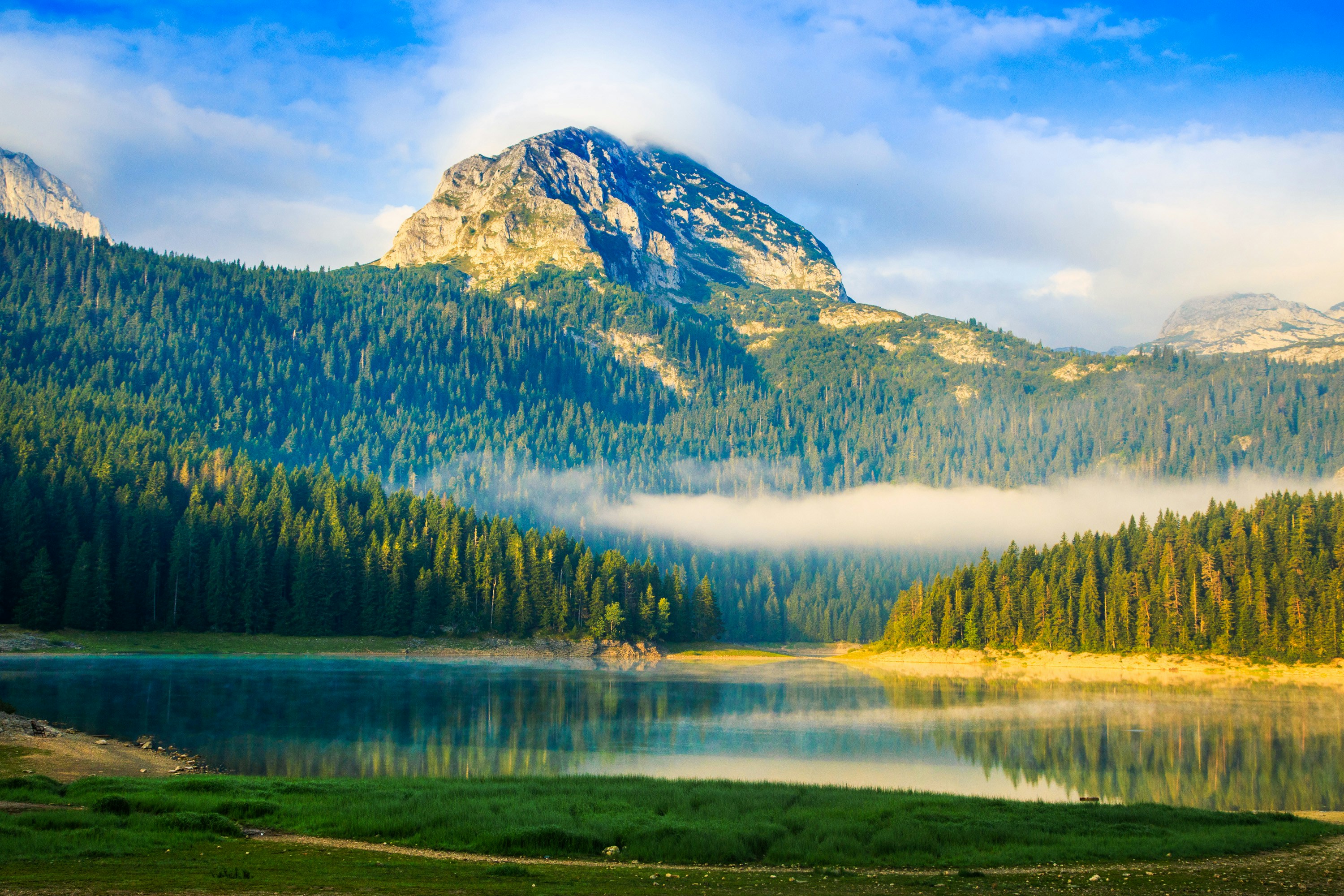An illustrative photo of a lake near a mountain.