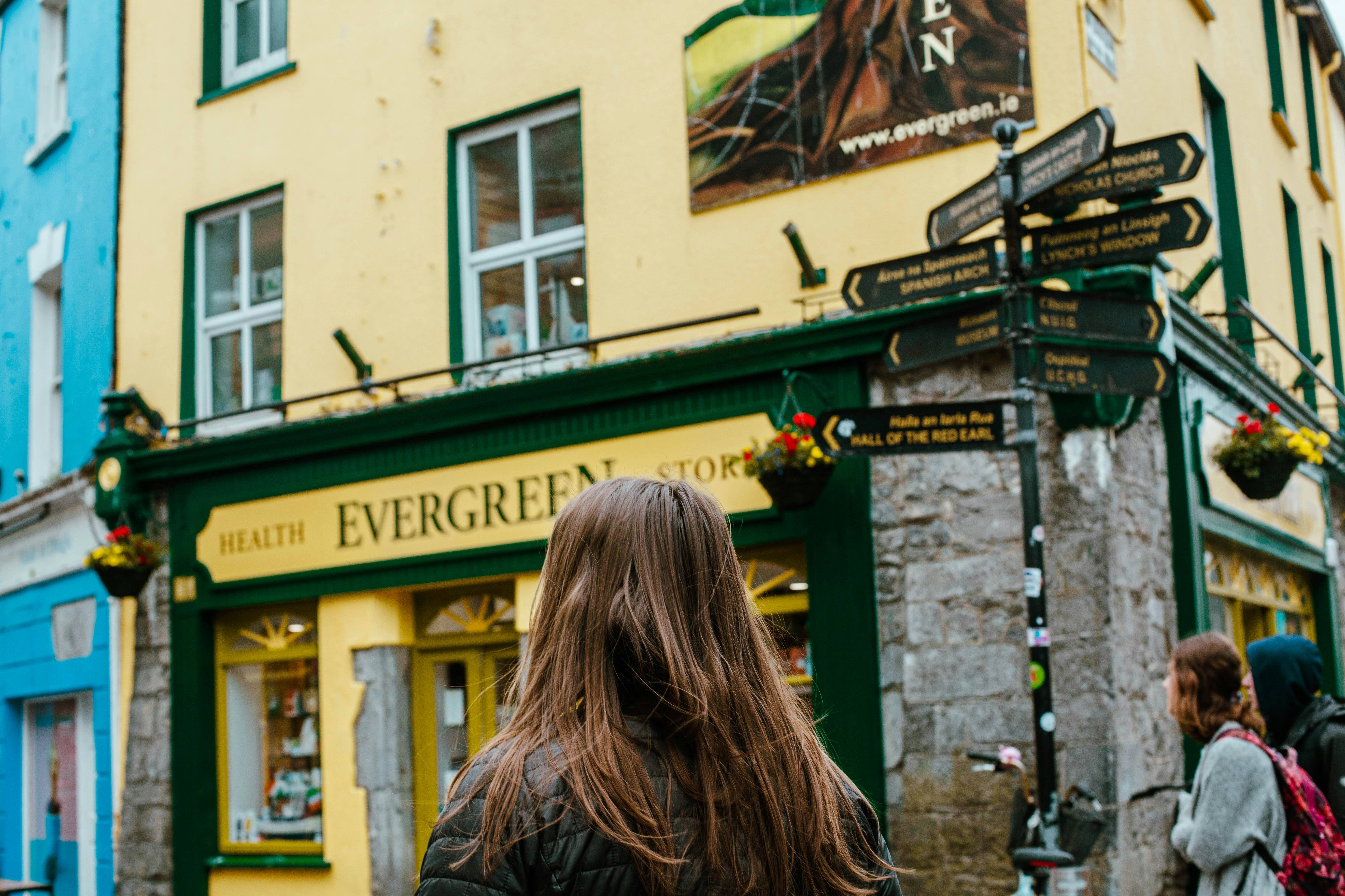 An illustrative photo of a woman walking down a street in Ireland