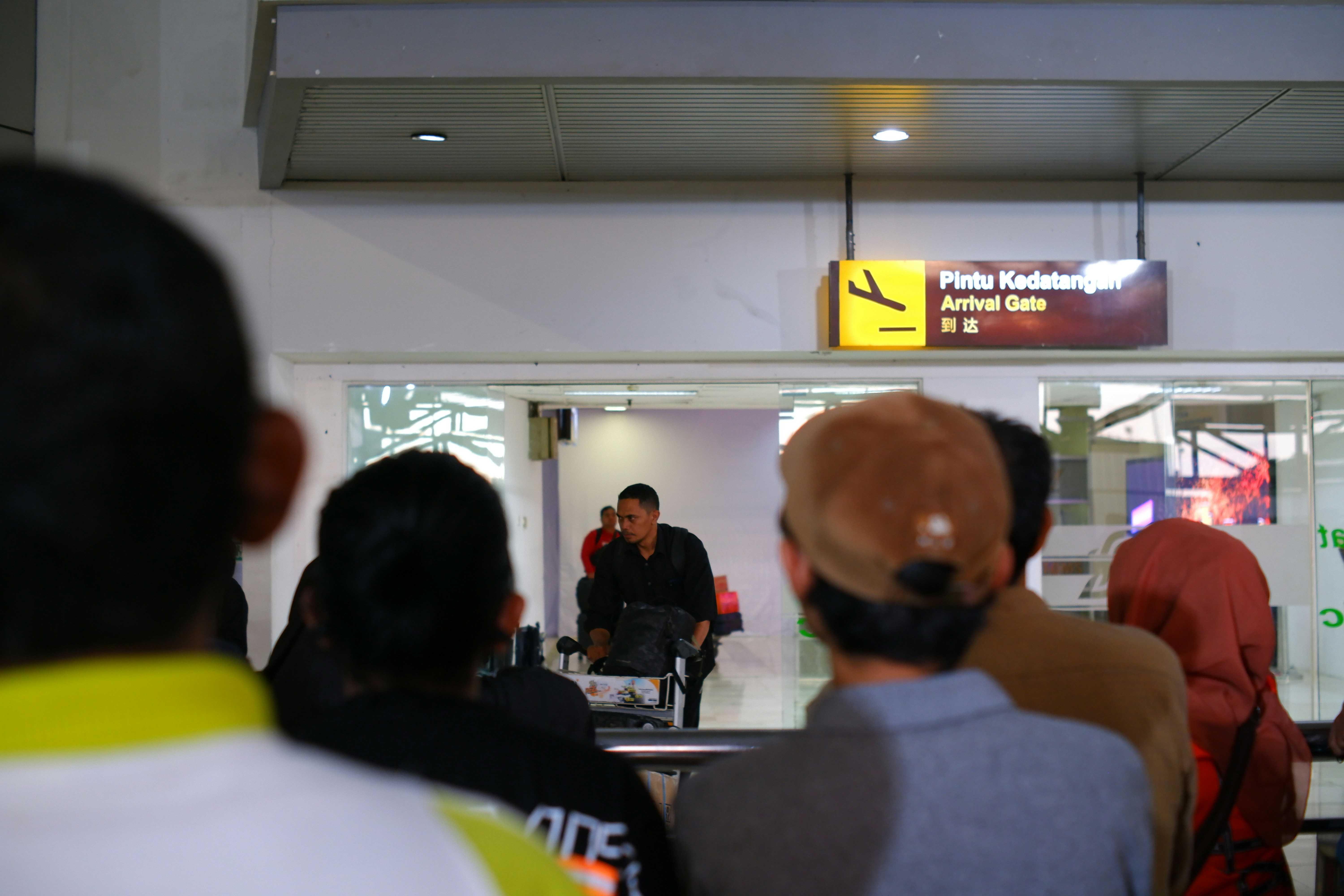 An illustrative photo of a group of people standing in a line in the airport