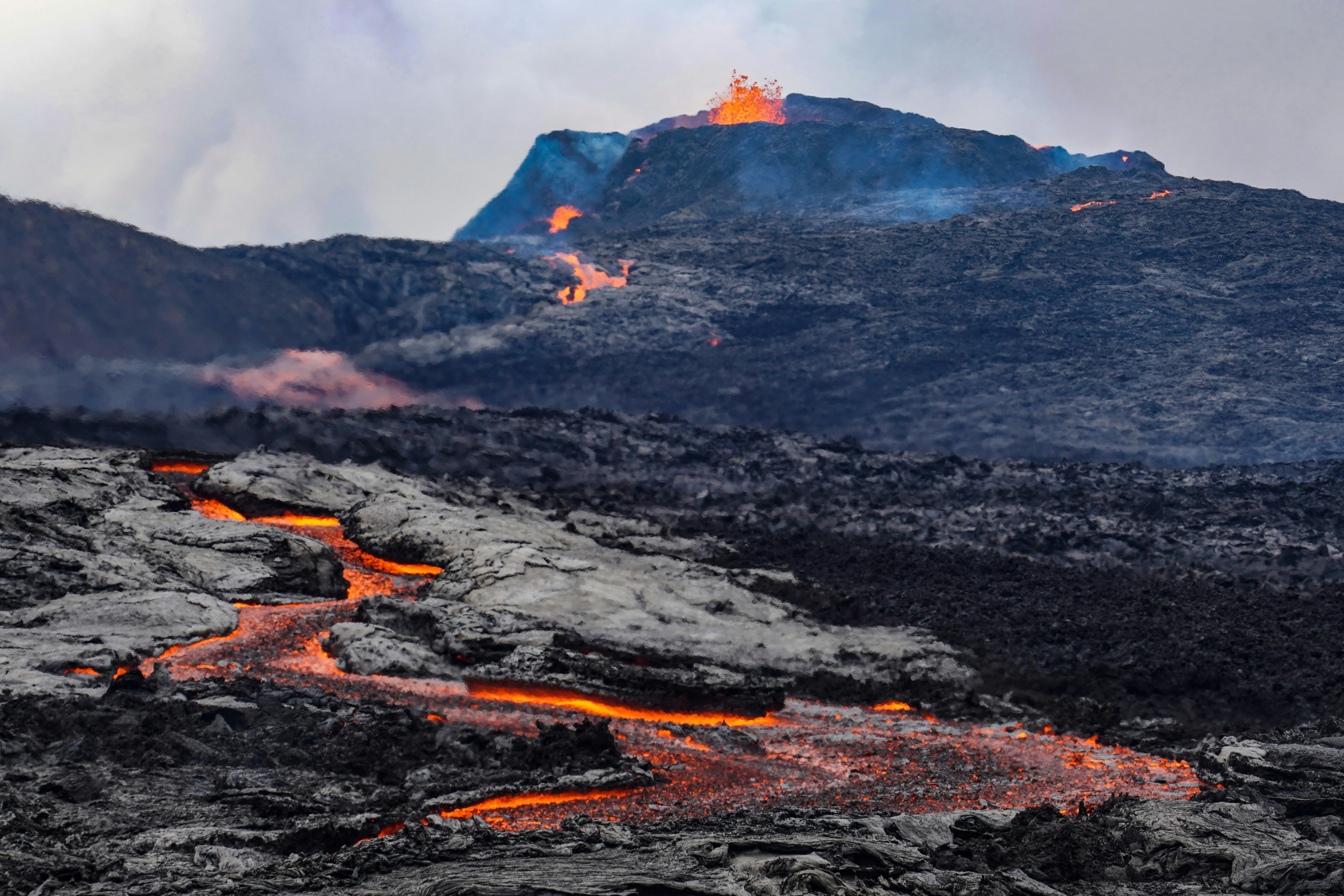 Photo by Unsplash An illustrative photo of a volcano with lava floating down the side of it